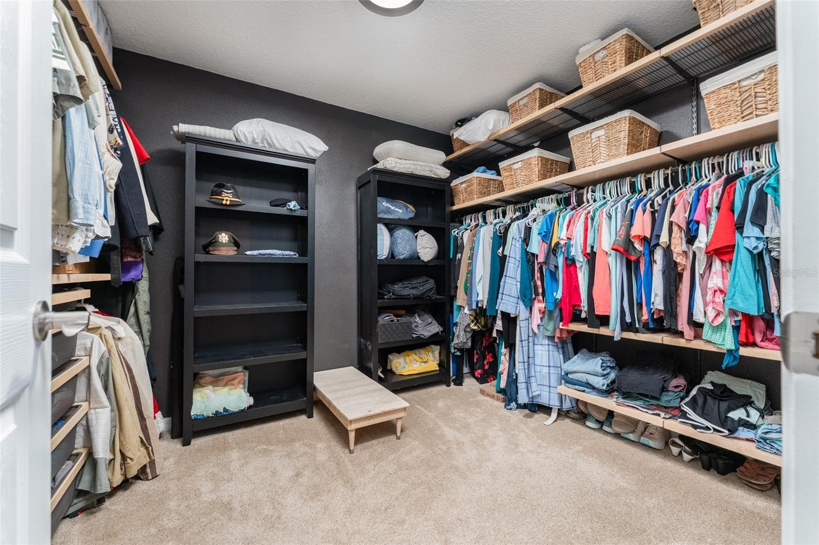 Walk-in closet with built shelving - 5431 SANDY SHELL DR, APOLLO BEACH