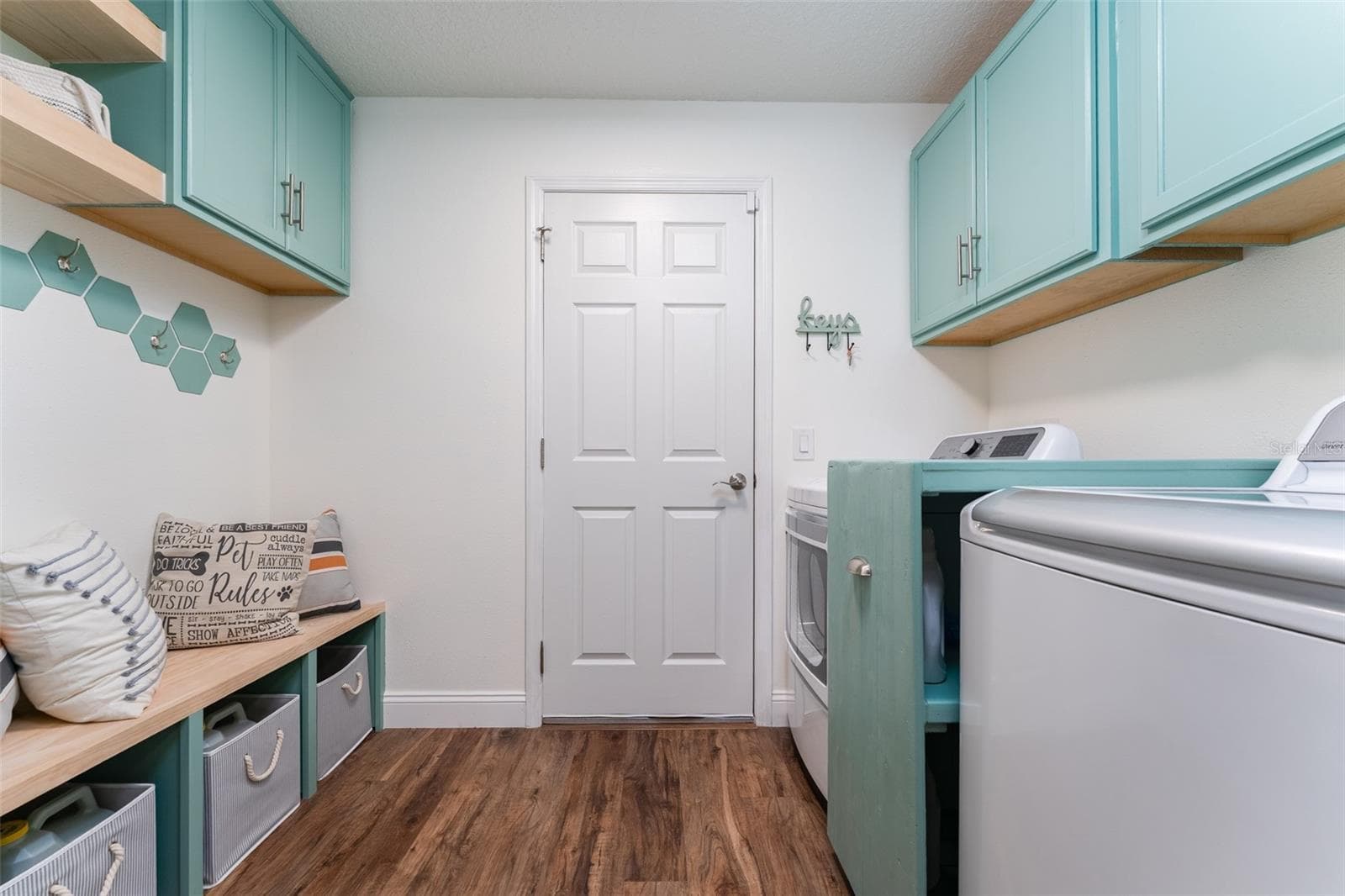 Laundry room with storage and LG washer and dryer. - 5431 SANDY SHELL DR, APOLLO BEACH