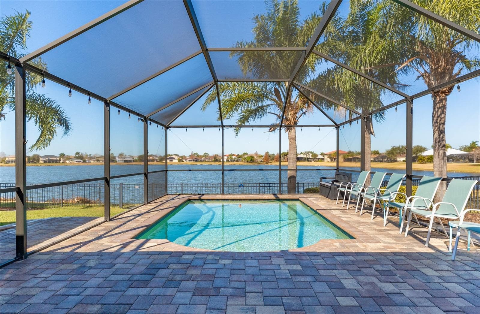 Screened pool with brick paver patio - 5431 SANDY SHELL DR, APOLLO BEACH