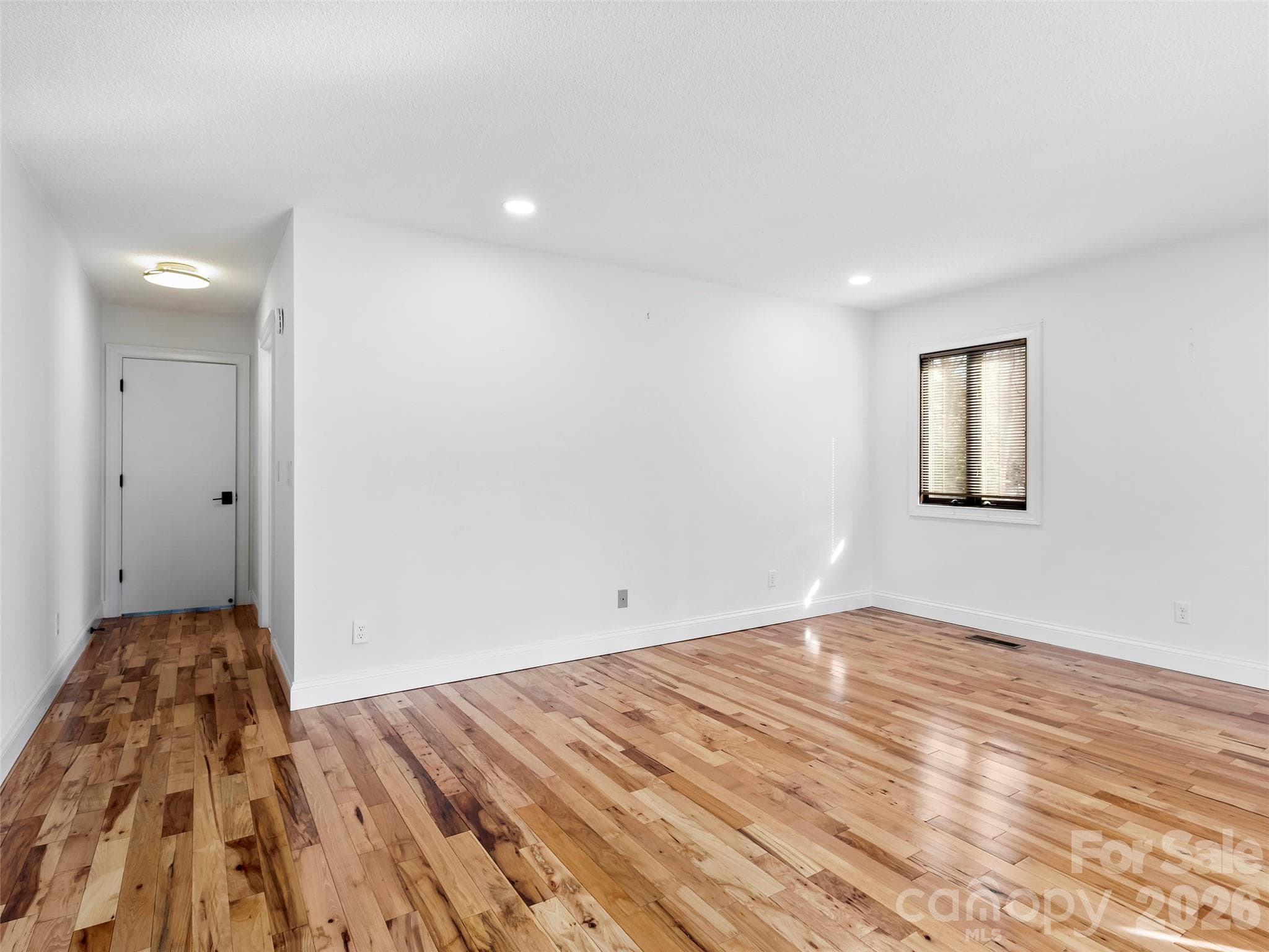Rich hickory floors throughout the main level add natural beauty, durability, and a touch of mountain charm. - 2731 Miller Lane, Hendersonville