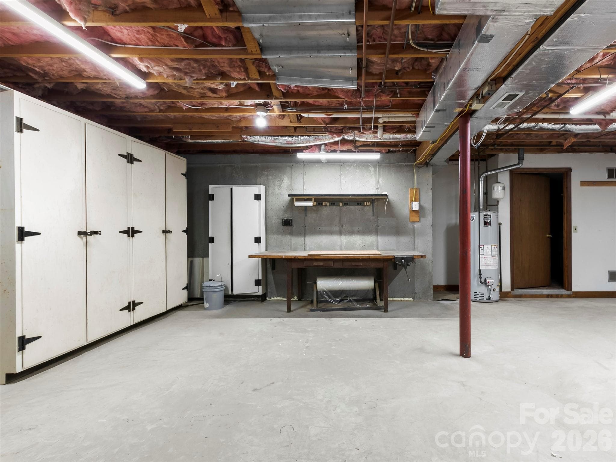 Lower level unfinished basement with excellent storage options. - 2731 Miller Lane, Hendersonville