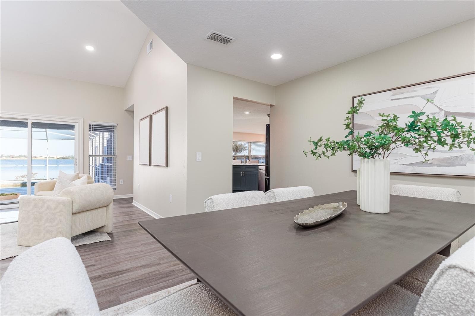 Dining Room off kitchen and living room with Lake Agnes and Pool View - 411 EDGEWATER DR, POLK CITY