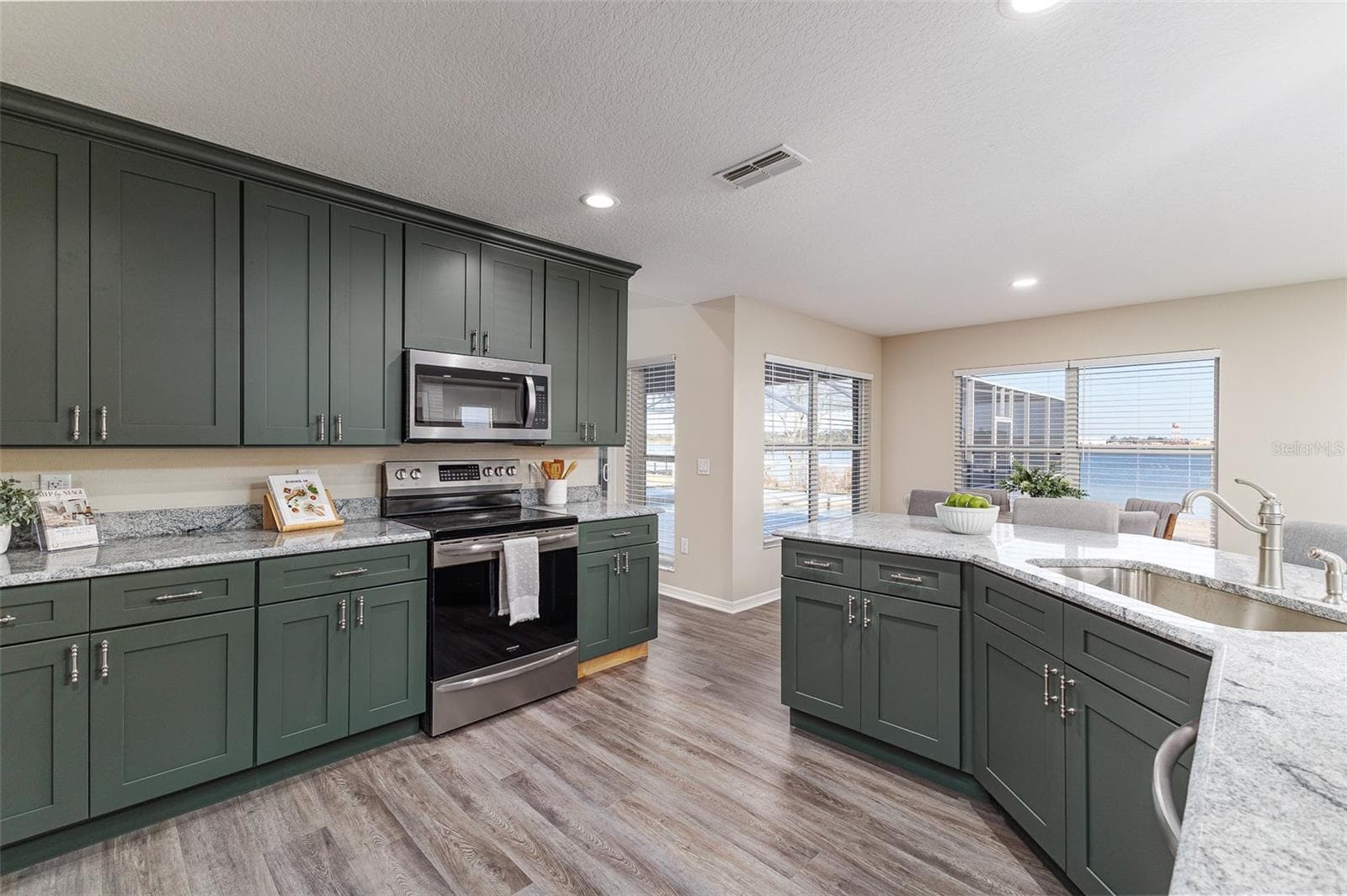 Kitchen with Lake Agnes and Pool View - 411 EDGEWATER DR, POLK CITY