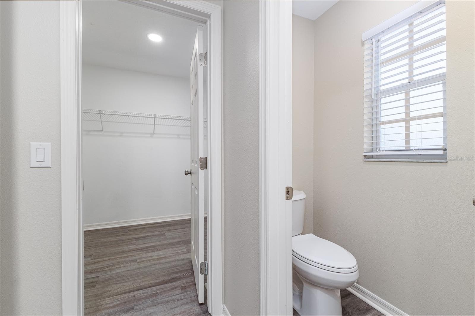 Walk-in-Closet entrance off of en-suite bathroom; separate water closet / toilet room. - 411 EDGEWATER DR, POLK CITY