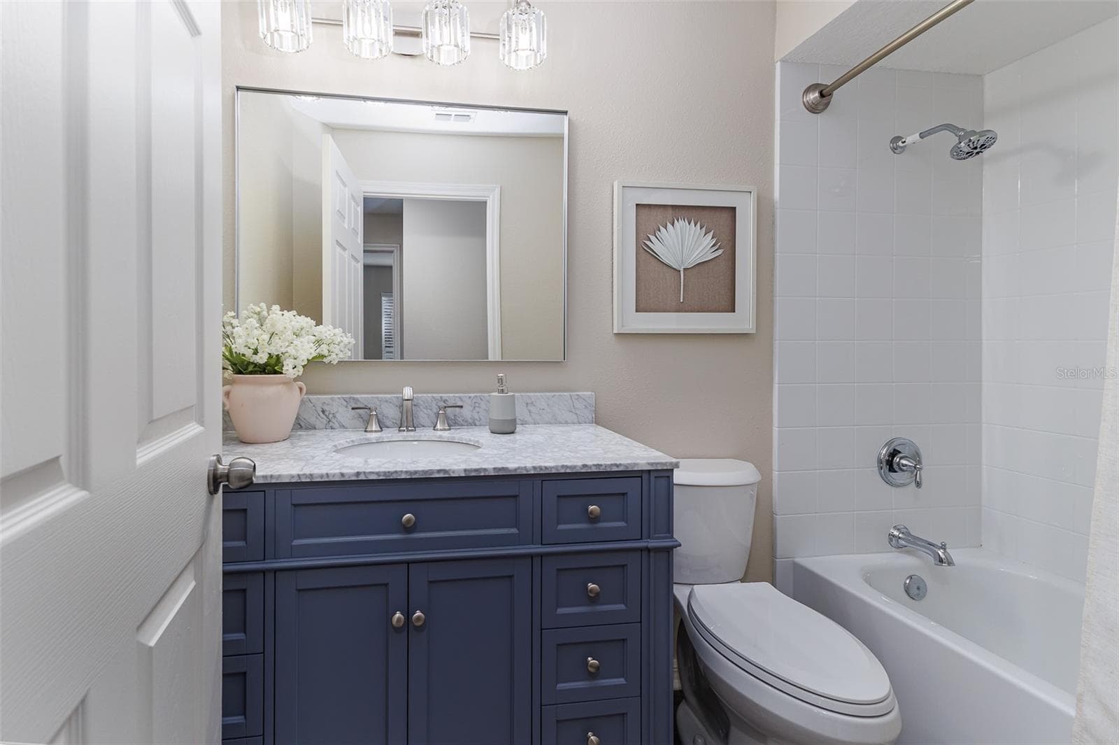 Hall Bathroom with Marble Top; Elongated Toilet, Tub with Shower - 411 EDGEWATER DR, POLK CITY