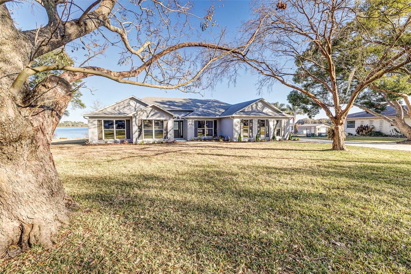 View from Cul De Sac facing front of house - 411 EDGEWATER DR, POLK CITY