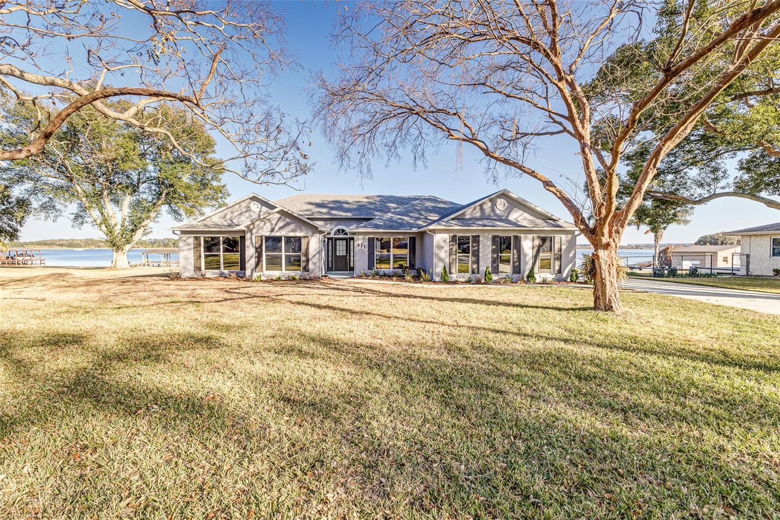 View from Side of Property facing pool and Lake Agnes - 411 EDGEWATER DR, POLK CITY