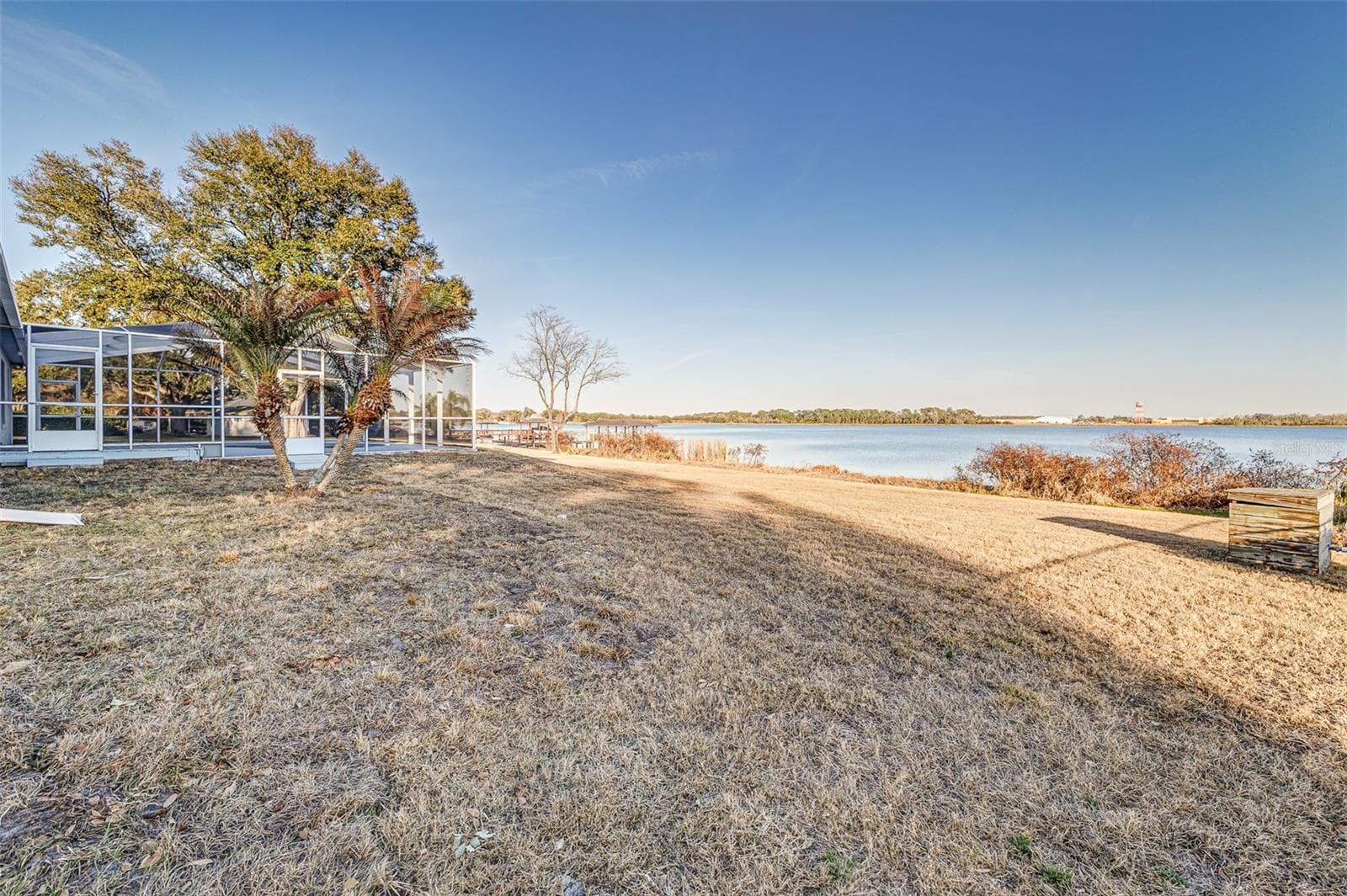 View from Side of Property facing pool and Lake Agnes - 411 EDGEWATER DR, POLK CITY