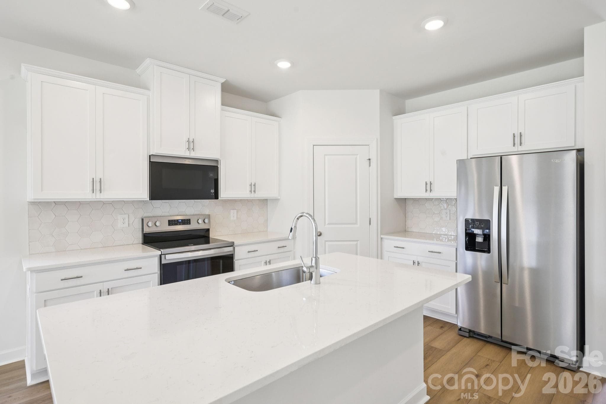 Photo is not of the actual home but is an inspirational photo of builder’s model home and may depict options, furnishings, and/or decorator features that are not included. - 1419 Blue Jay Street, Newton