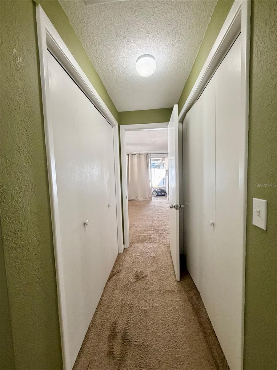 Dual closets in Primary bedroom looking out to family room. - 110 S CORONA AVE, CLEARWATER