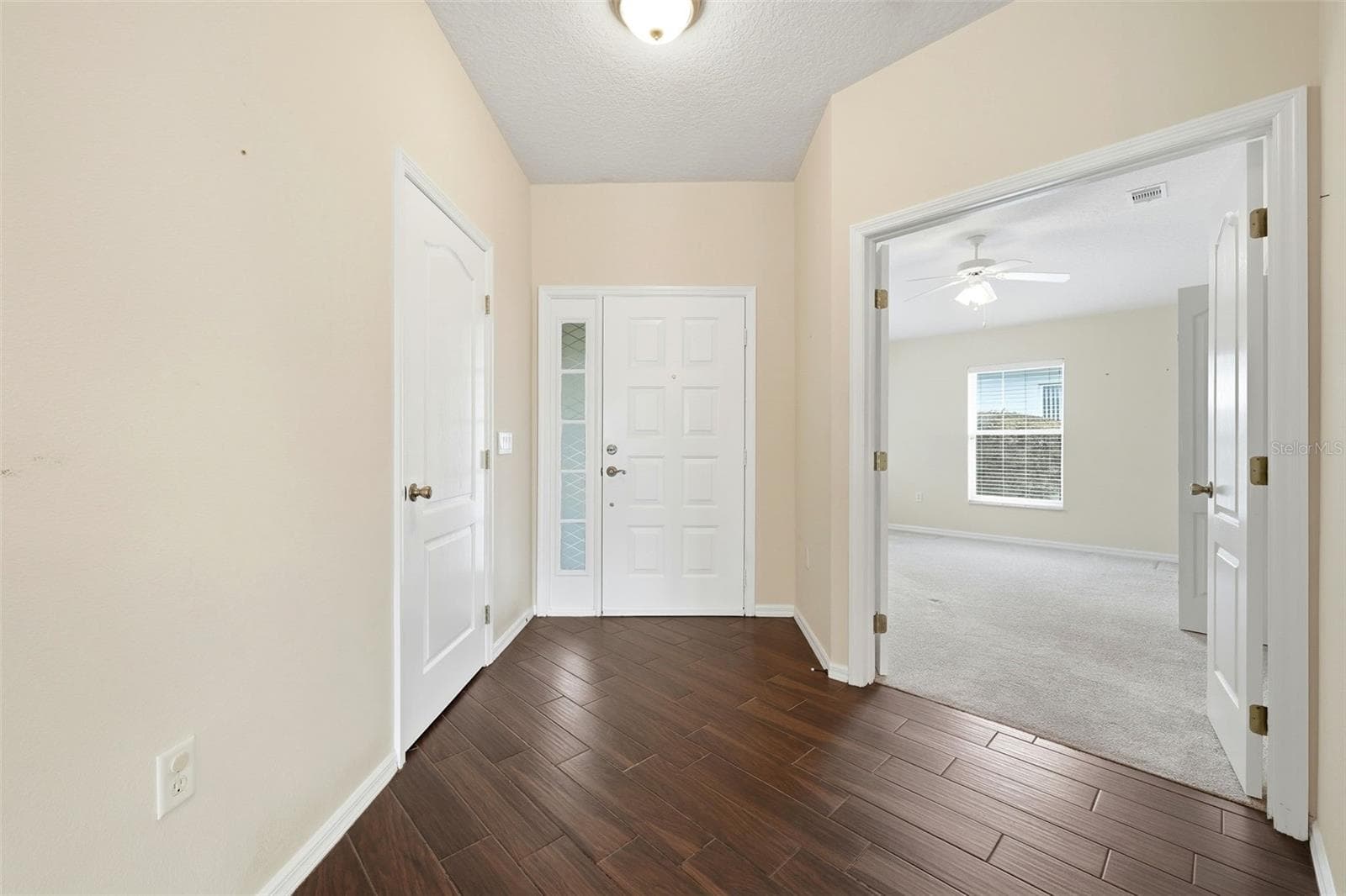 Inside entrance with coat closet and double doors to office/den or third bedroom - 2311 N ANDREA PT, LECANTO
