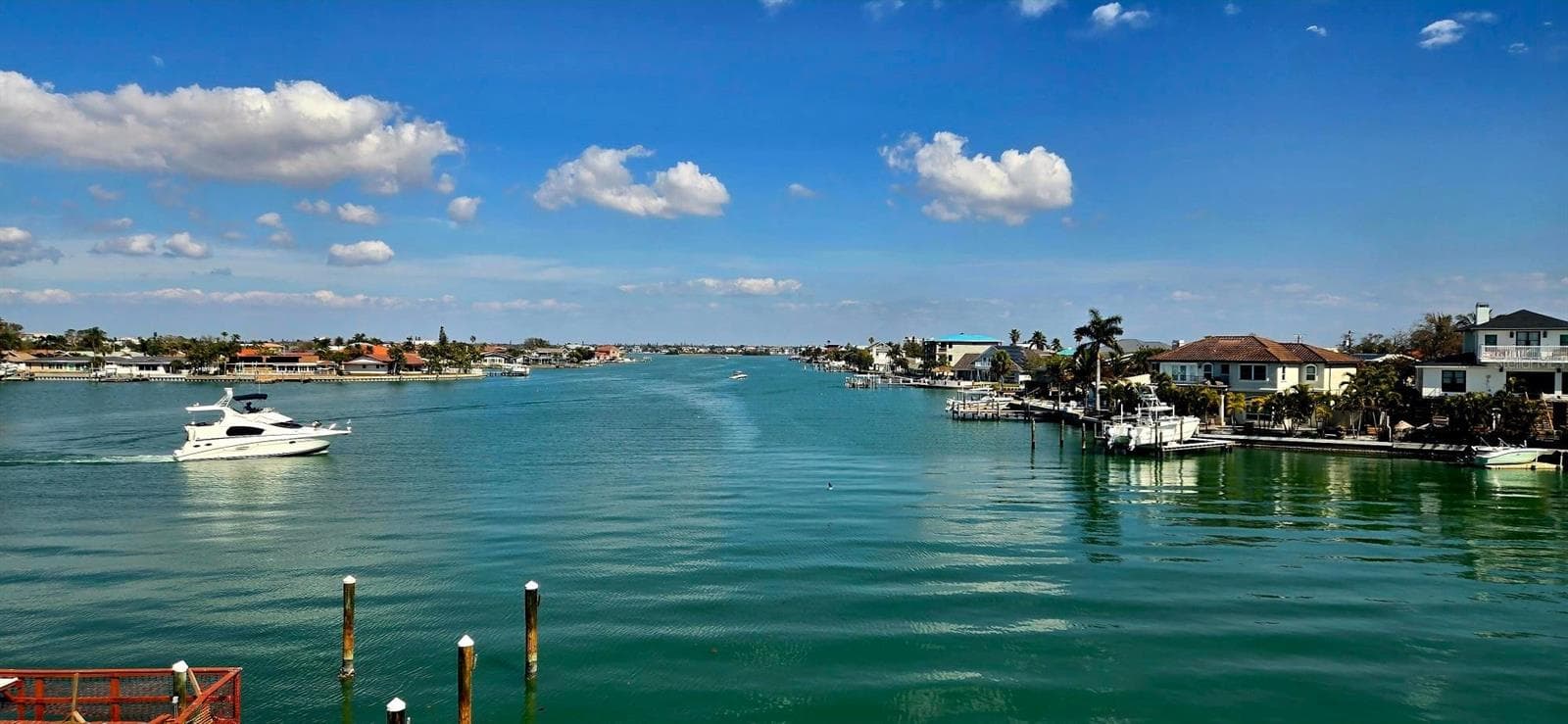 Florida room, living room & primary bedroom bay views. - 6061 2ND ST E #55, ST PETE BEACH