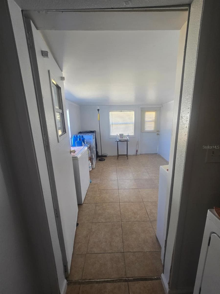 From the laundry room to the mudroom - 6106 MANGROVE DR, WESLEY CHAPEL