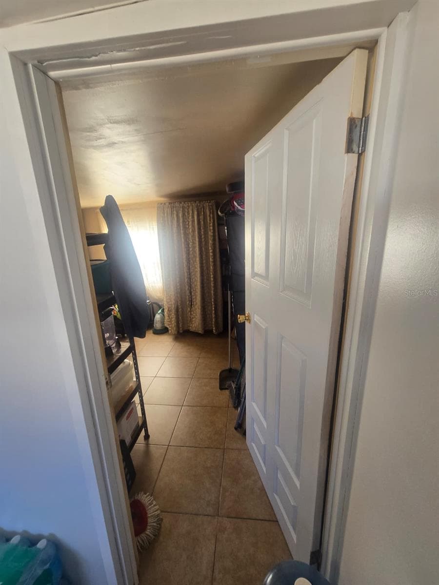 Door on the right of the mudroom towards storage area room - 6106 MANGROVE DR, WESLEY CHAPEL