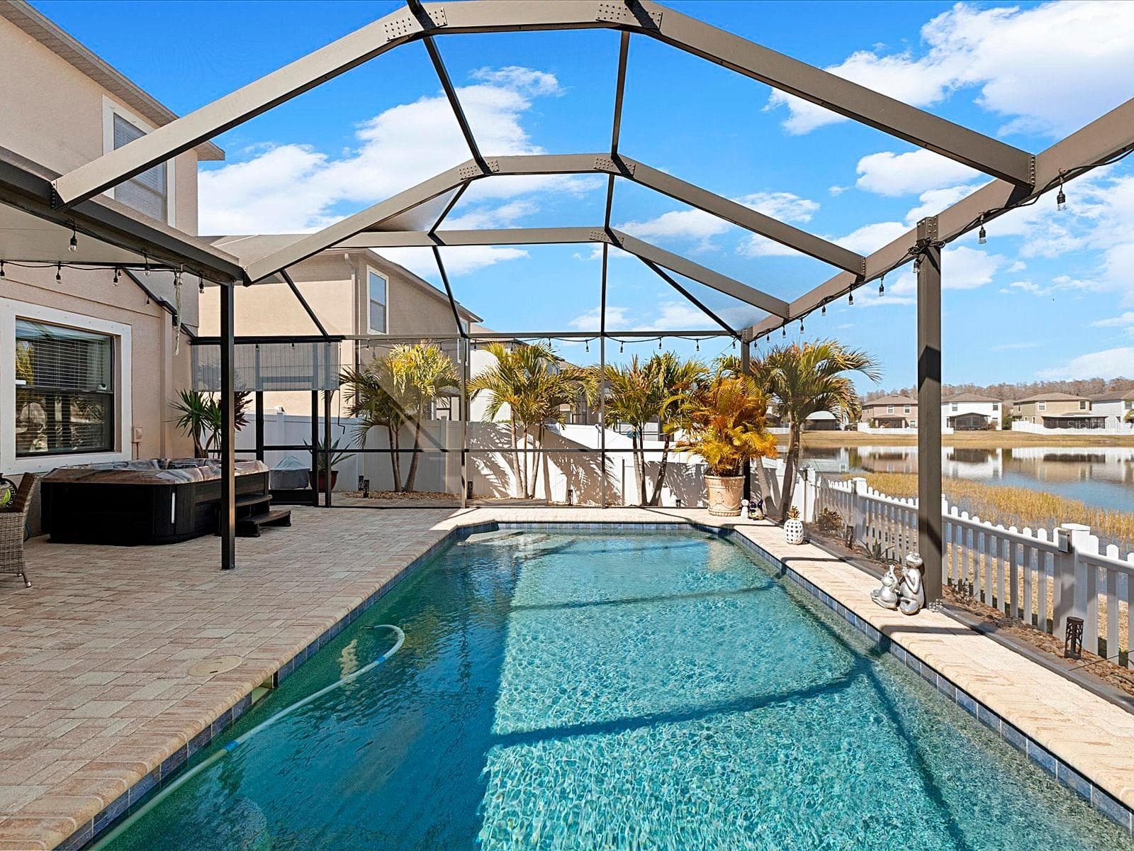 Covered Lanai overlooking pool and pond - 1716 HADDEN HALL PL, TRINITY