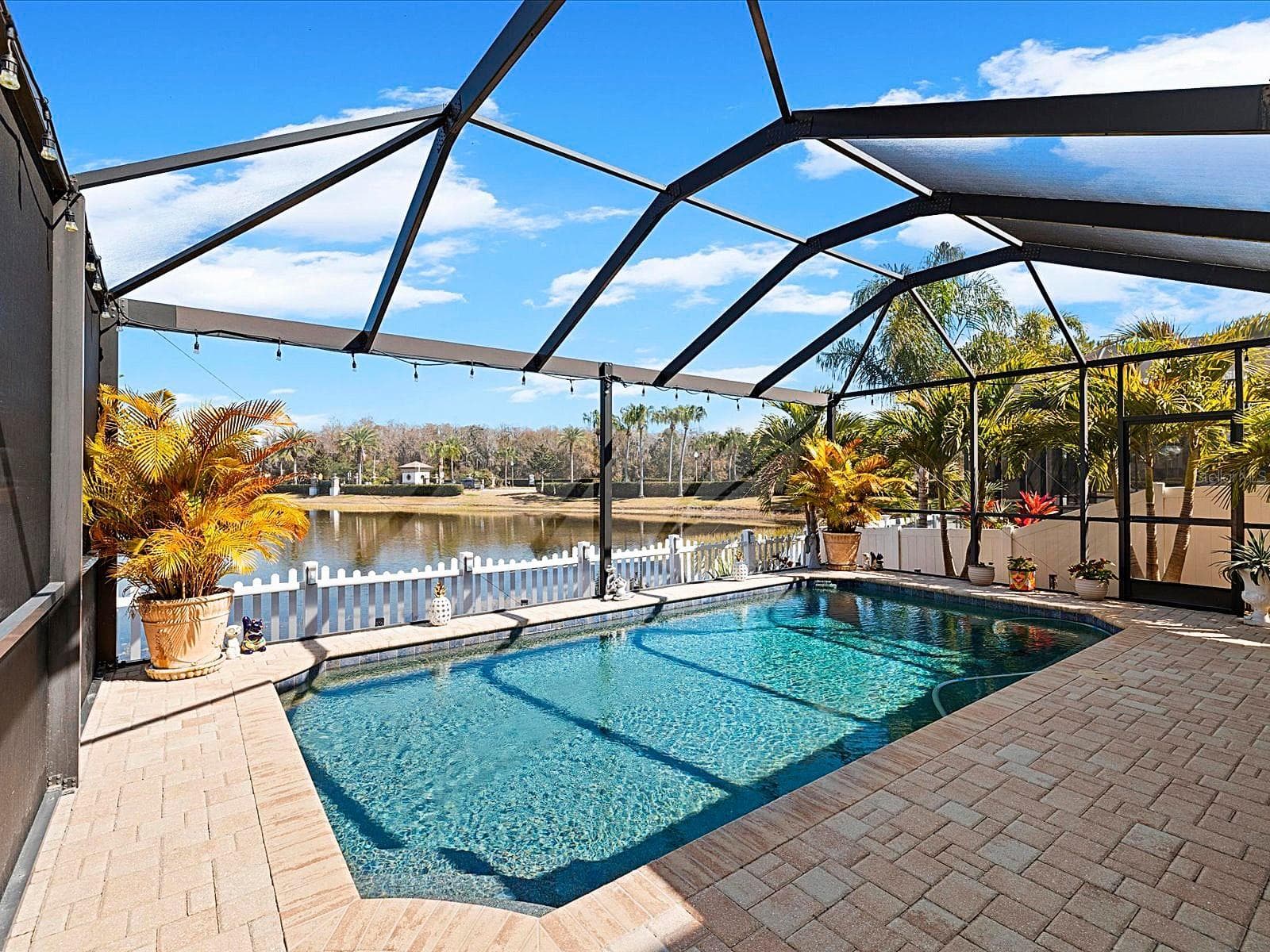 Covered Lanai overlooking pool and pond - 1716 HADDEN HALL PL, TRINITY