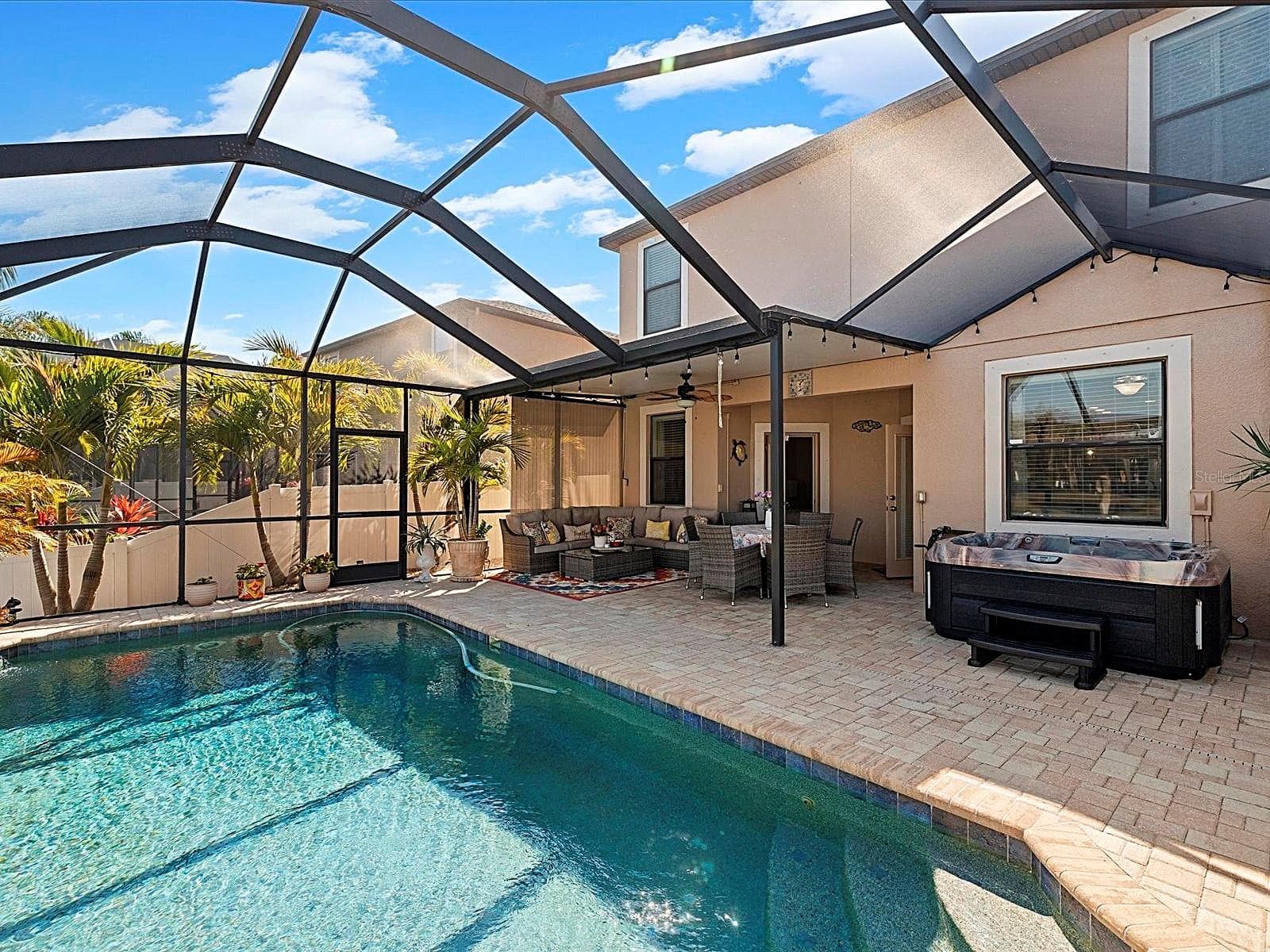 Covered Lanai overlooking pool and pond - 1716 HADDEN HALL PL, TRINITY