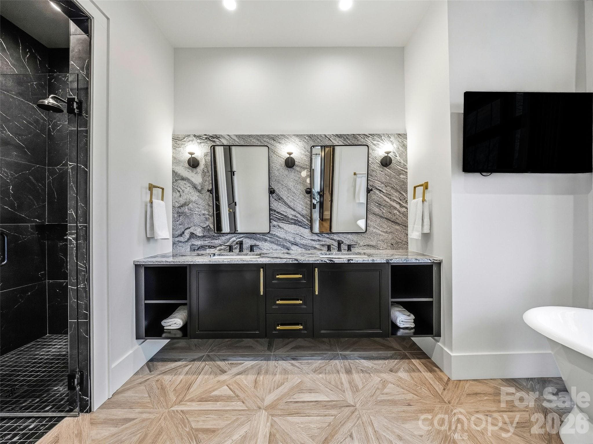 Primary bath with oversized dual vanity, statement mirrors, and sleek modern finishes - 241 Tower Circle, Hendersonville