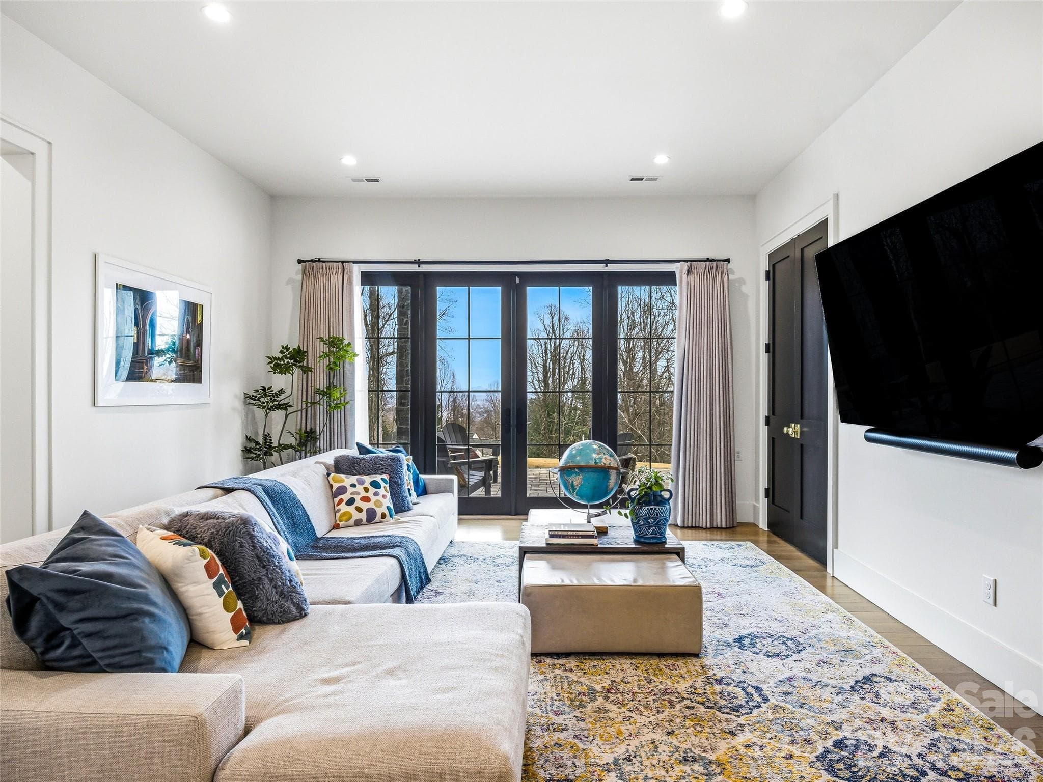 Spacious den with large windows and abundant natural light. - 241 Tower Circle, Hendersonville