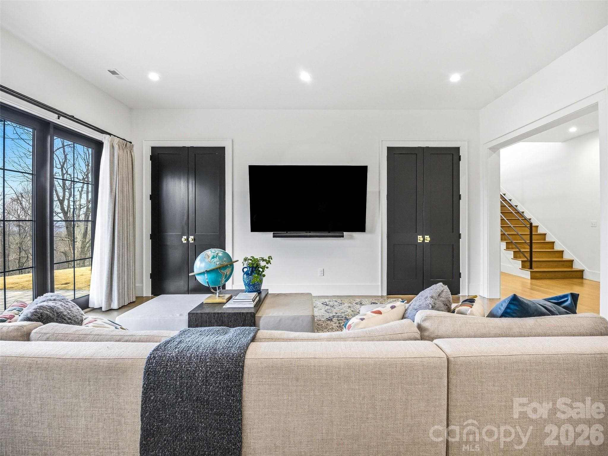 Flexible lower-level space with media wall and modern finishes - 241 Tower Circle, Hendersonville