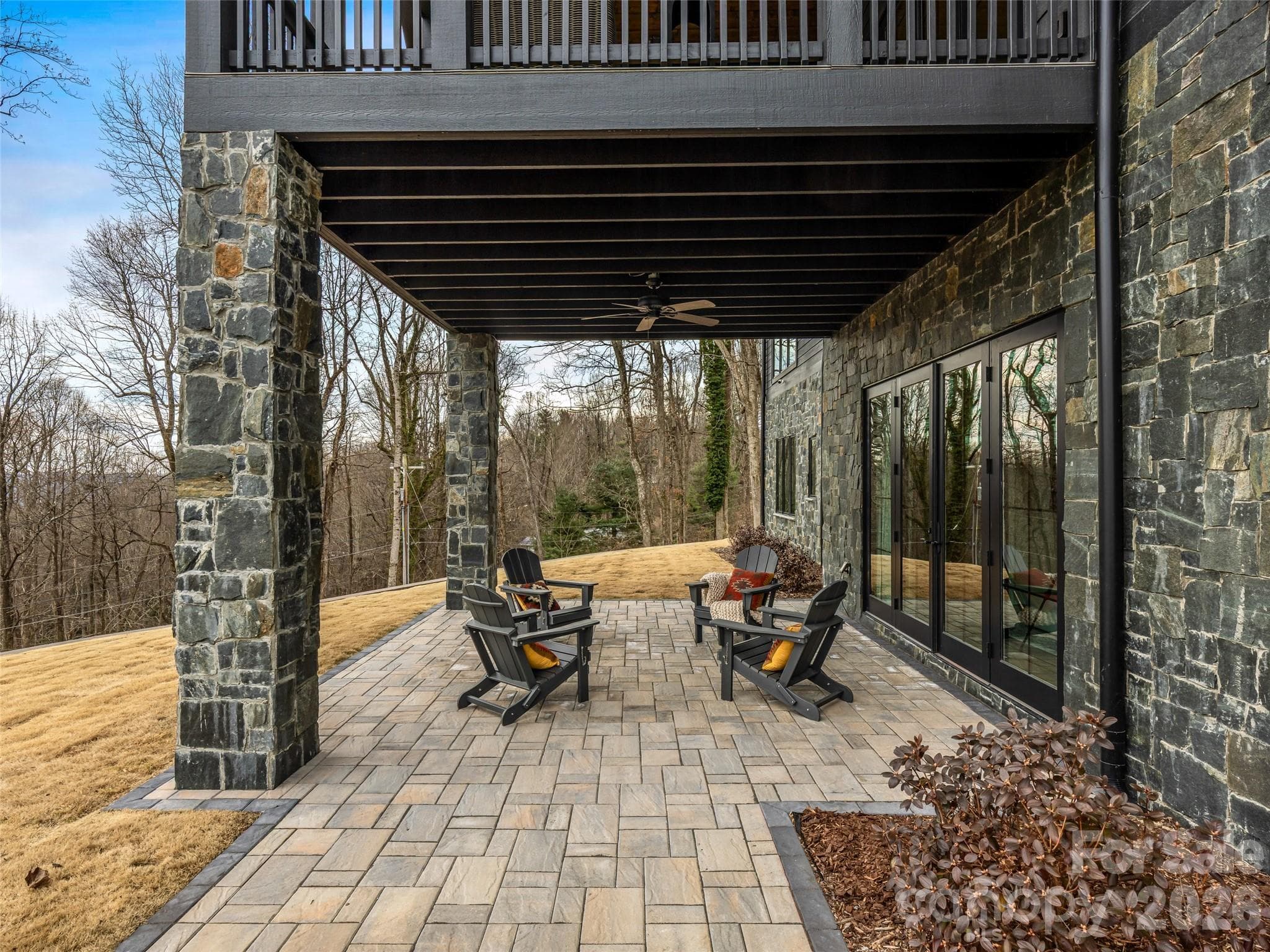 Spacious covered patio offering seamless indoor-outdoor flow from the lower level. - 241 Tower Circle, Hendersonville
