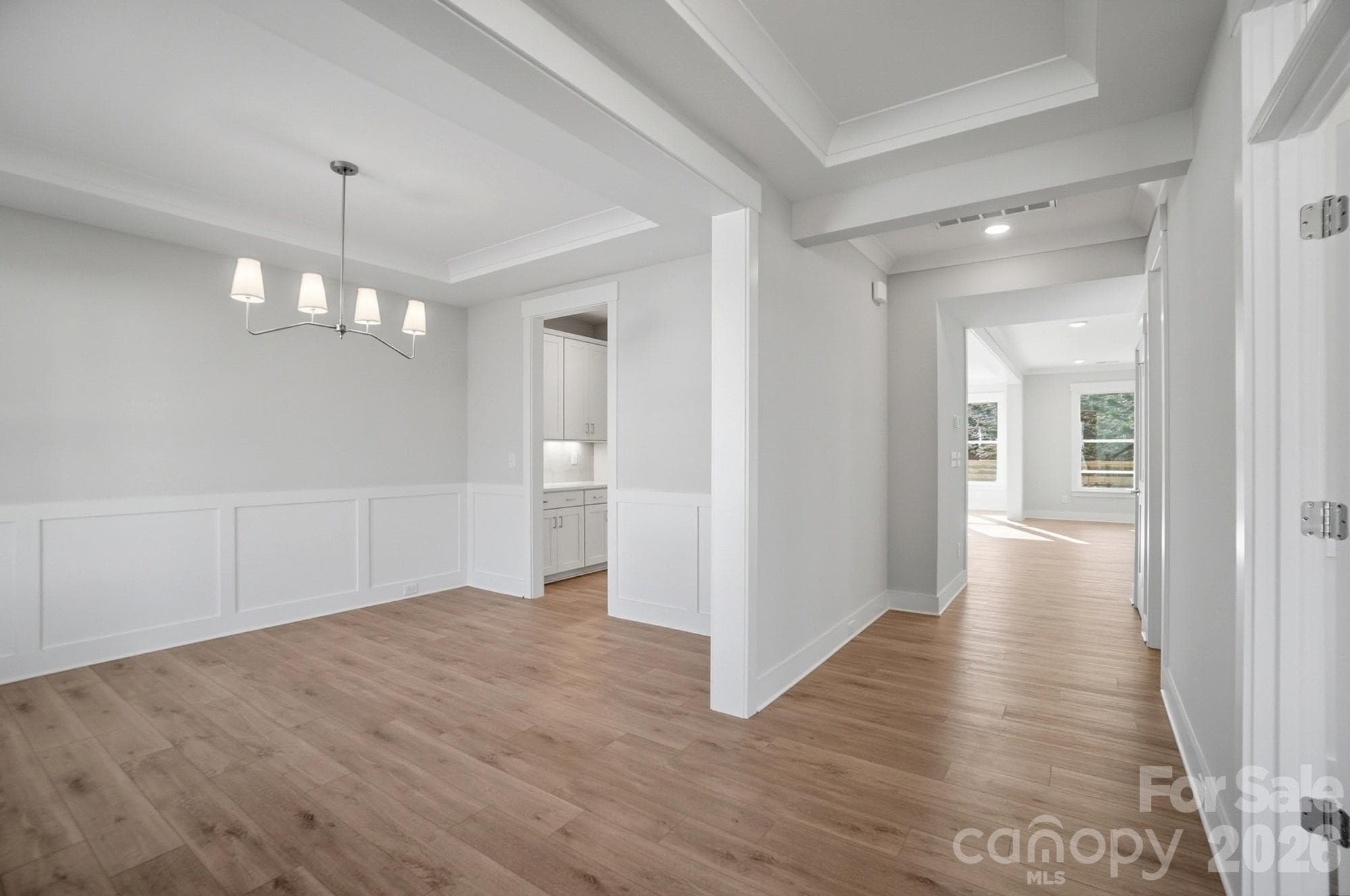 Dining room with Craftsman-style trim and tray ceiling - 5054 McLaughlin Loop, Waxhaw