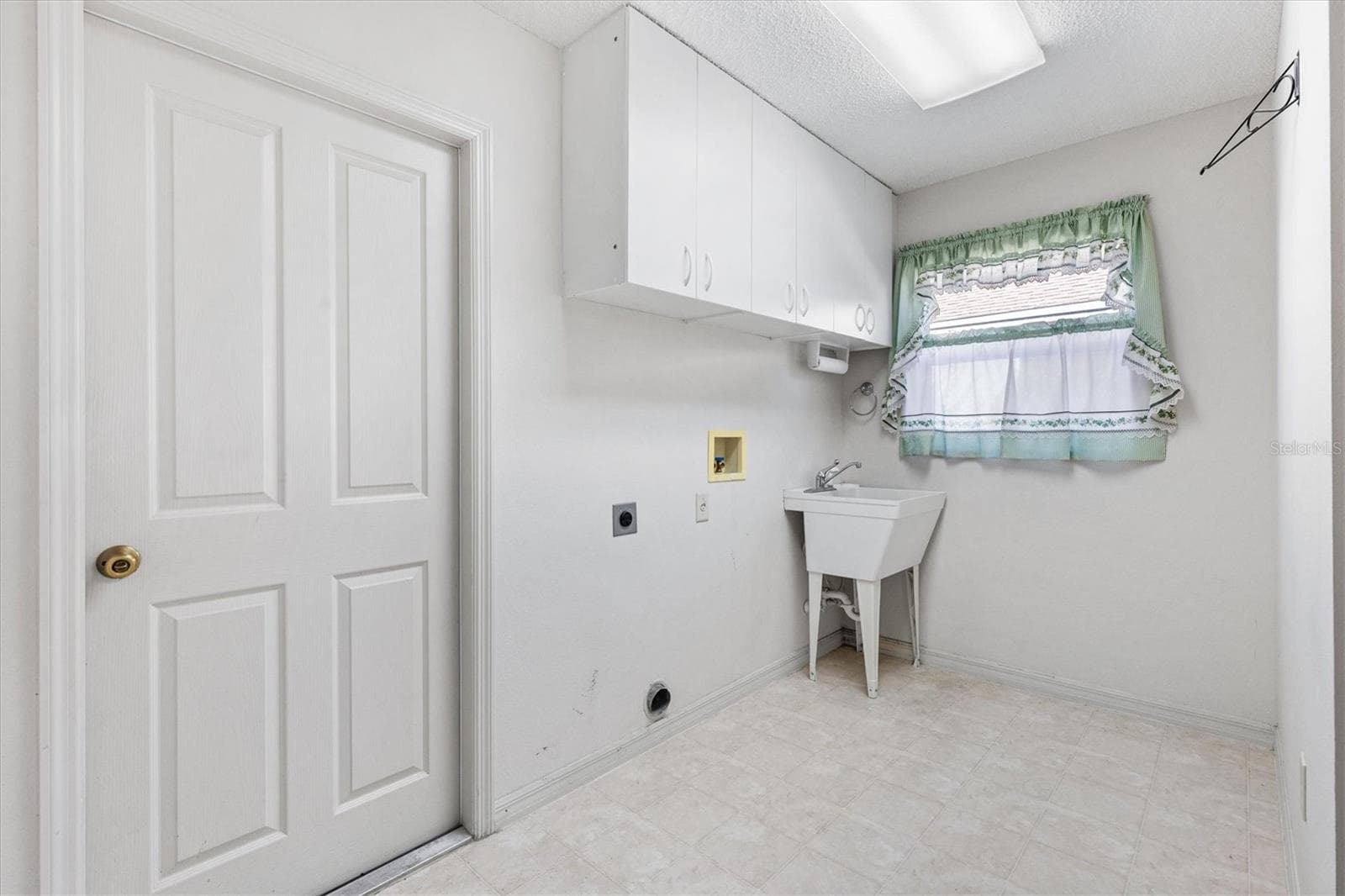 Inside laundry room off of kitchen....leading to the garage - 17723 SE 81ST TIMBERWOOD TERRACE, THE VILLAGES