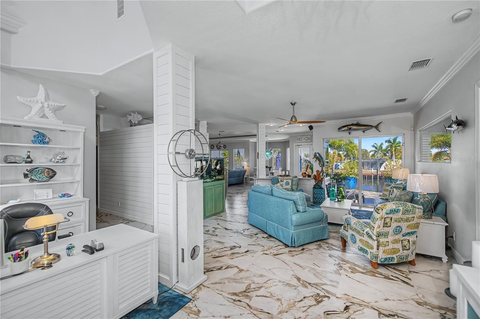 View from Front Door of Living Room with Shiplap, New Tile Floors and Views across Canal - 290 TAIT TER SE, PORT CHARLOTTE