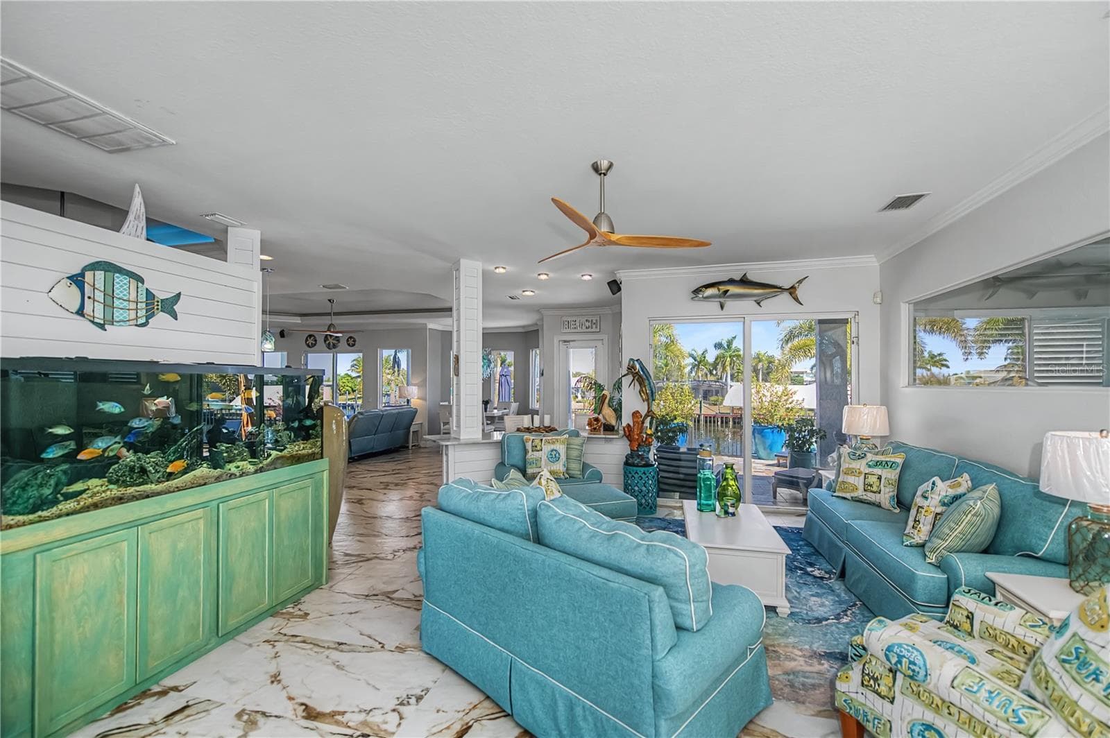 Living Room with Shiplap, New Tile Floors and Views across Canal - 290 TAIT TER SE, PORT CHARLOTTE