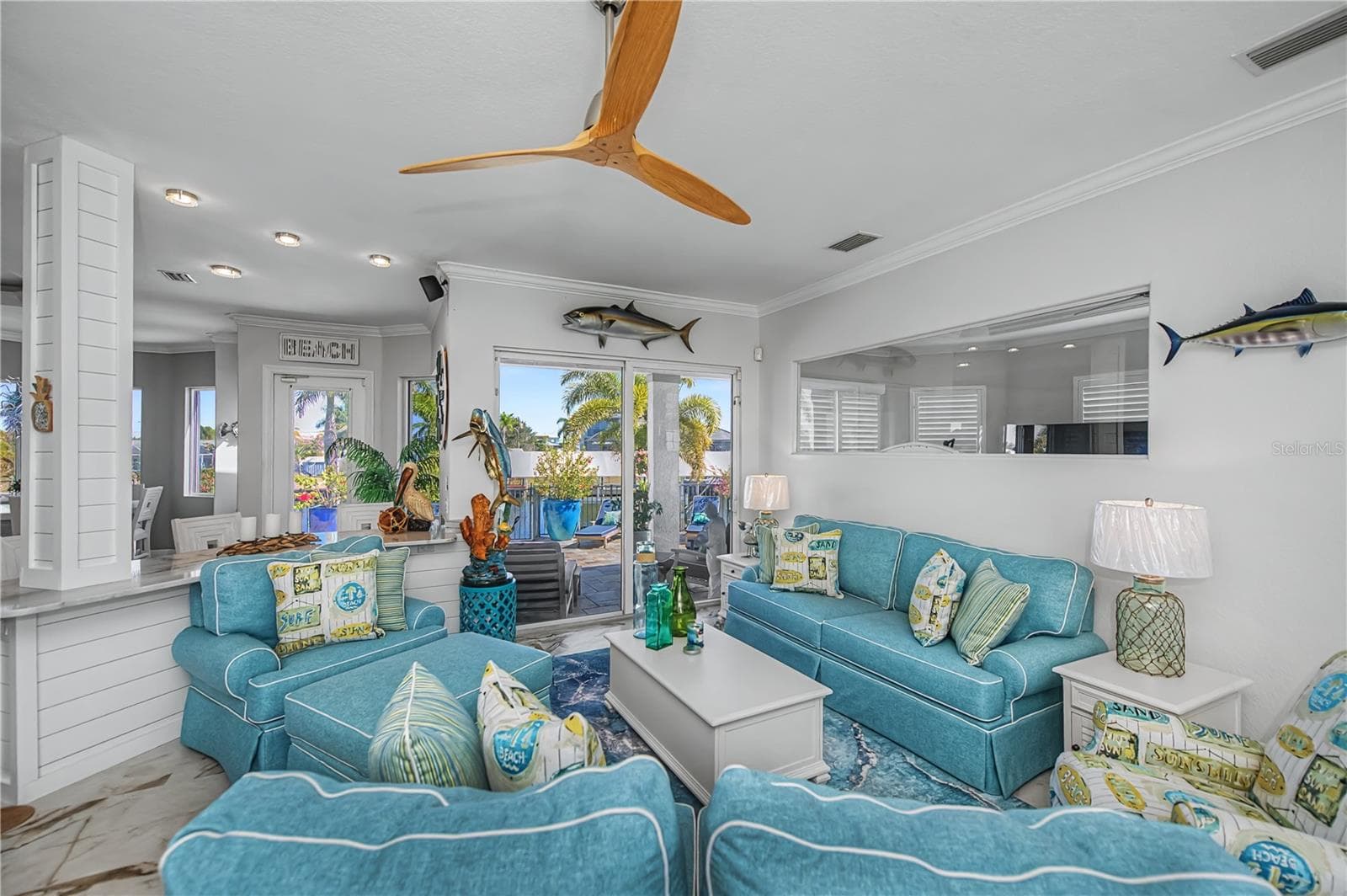 Close Up of Living Room with Shiplap, New Tile Floors and Views across Canal - 290 TAIT TER SE, PORT CHARLOTTE