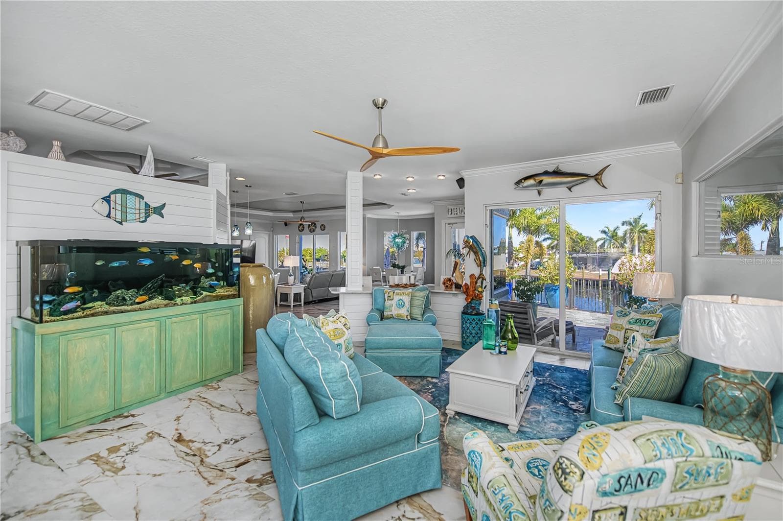 Living Room with Shiplap, New Tile Floors and Views across Canal - 290 TAIT TER SE, PORT CHARLOTTE