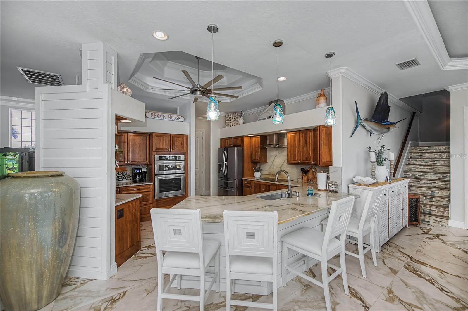View of Breakfast Bar, Quartz Countertops with Real Wood Cabinetry, Built in Stainless Appliances - 290 TAIT TER SE, PORT CHARLOTTE