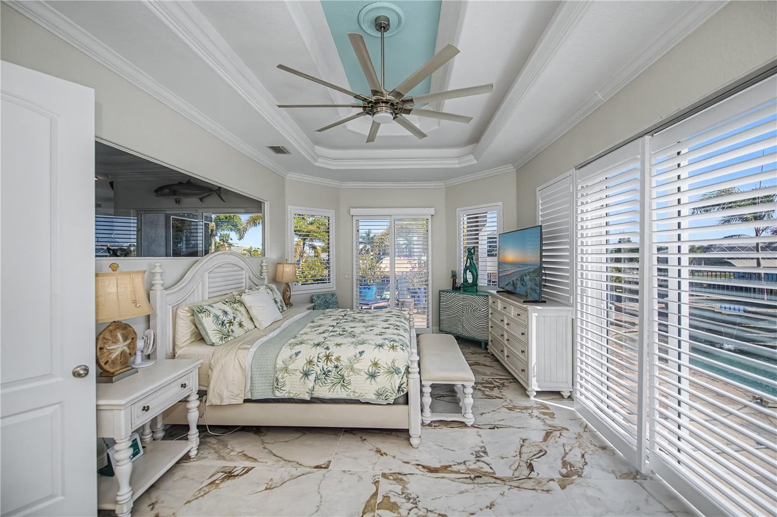 Primary Bedroom First Floor with Pool Access, Views down the Harbor, Two Walk in Closets and Luxurious On Suite Bathroom - 290 TAIT TER SE, PORT CHARLOTTE