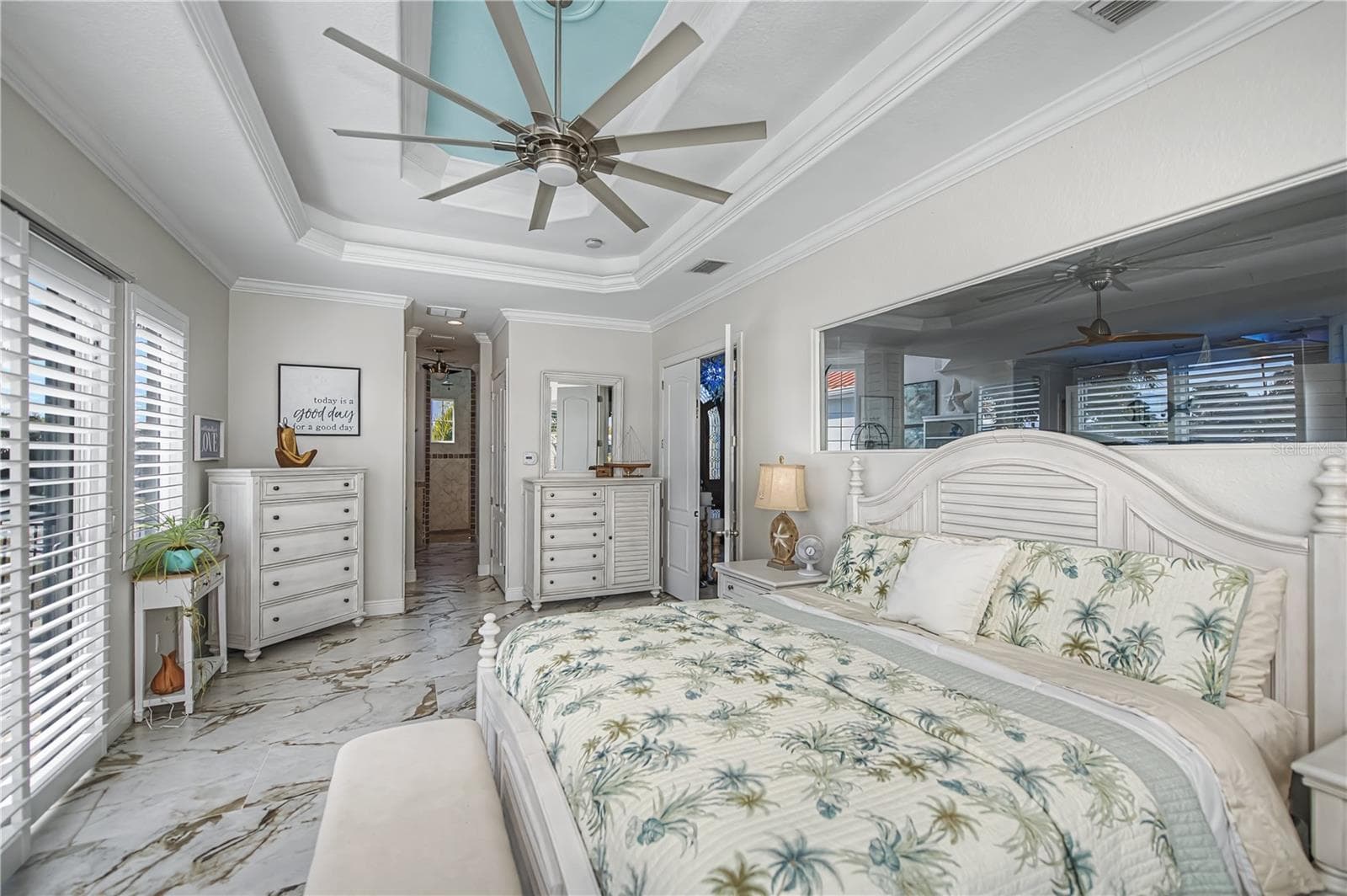 Primary Bedroom First Floor with Pool Access, Views down the Harbor, Two Walk in Closets and Luxurious On Suite Bathroom - 290 TAIT TER SE, PORT CHARLOTTE