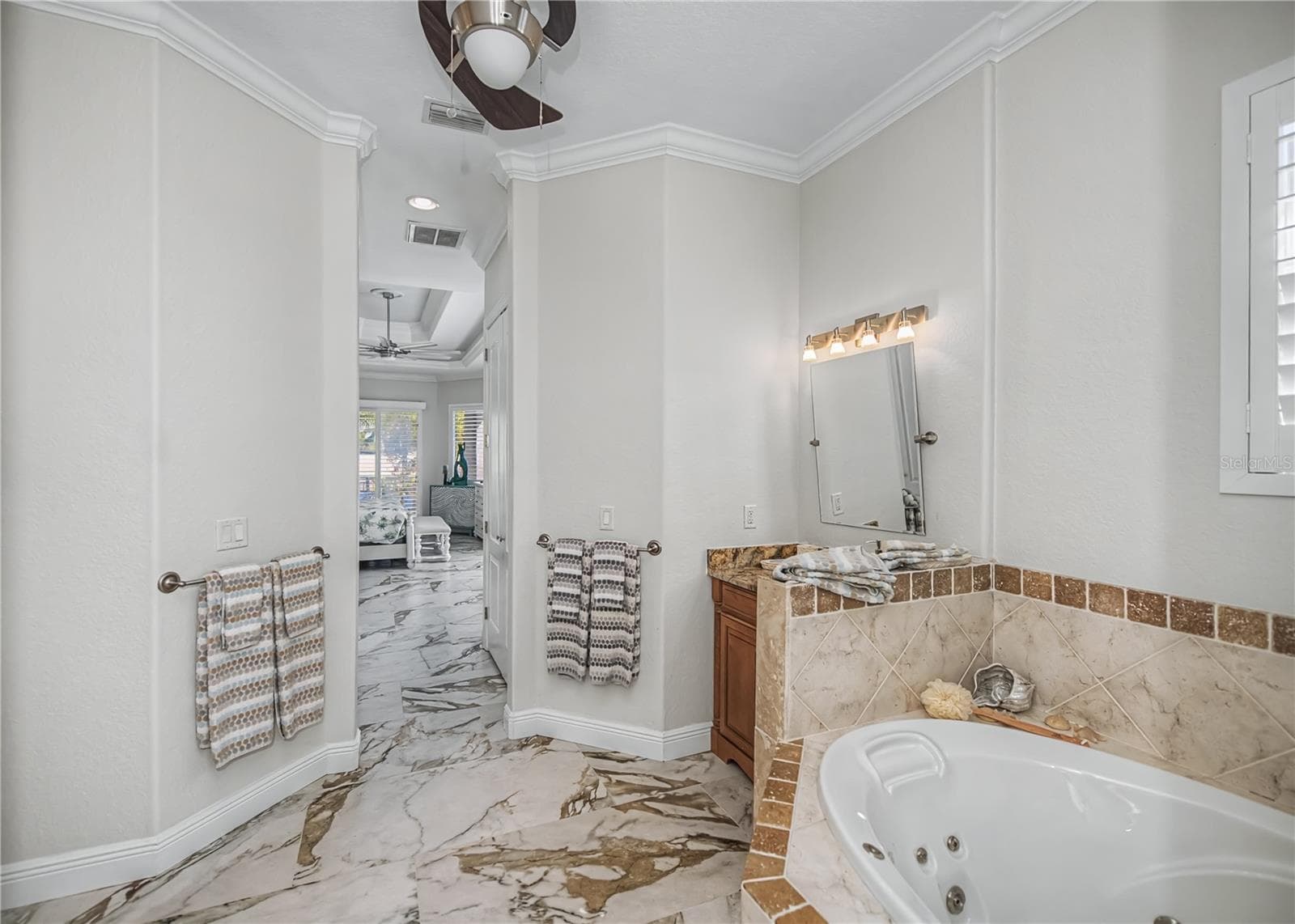 First Floor On Suite Bathroom with Jacuzzi Soaking Tub, His and Her Vanity, Walk in Shower with 14Ft Ceilings and Dual Shower Heads. - 290 TAIT TER SE, PORT CHARLOTTE