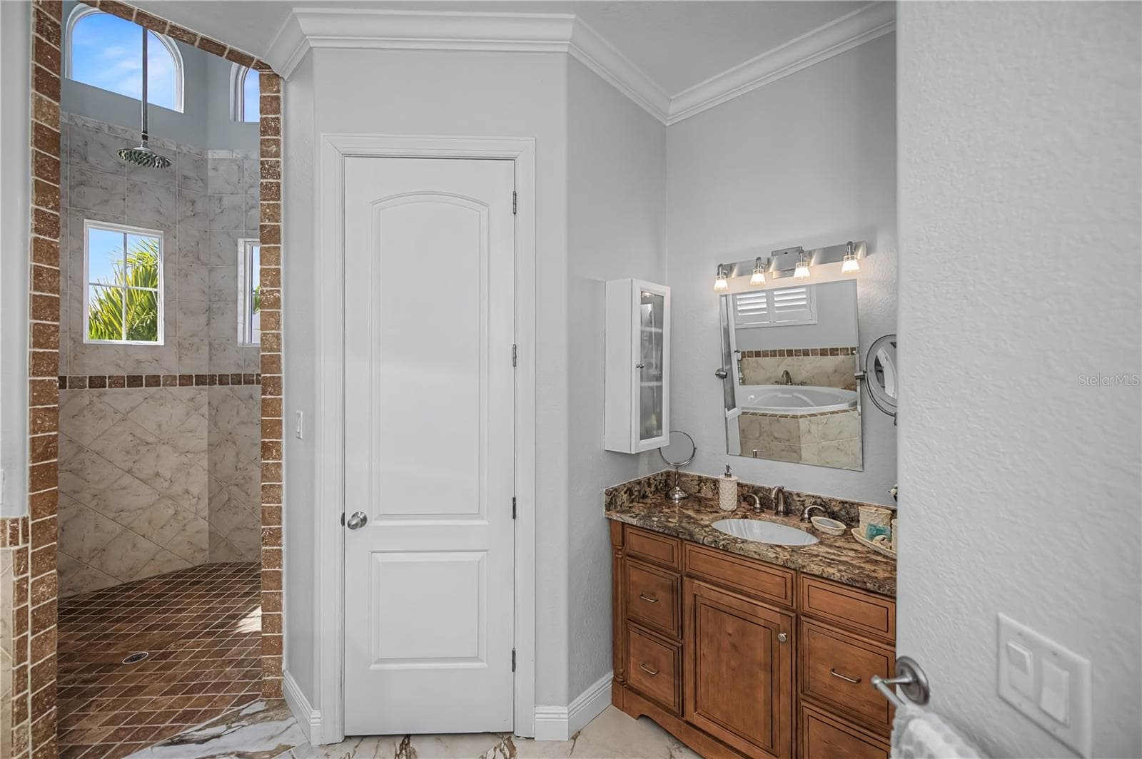 First Floor On Suite Bathroom with Jacuzzi Soaking Tub, His and Her Vanity, Walk in Shower with 14Ft Ceilings and Dual Shower Heads. - 290 TAIT TER SE, PORT CHARLOTTE