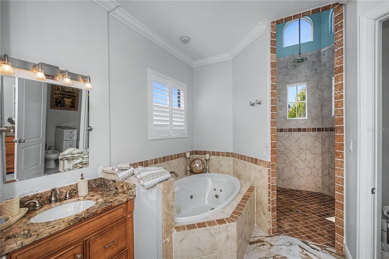 First Floor On Suite Bathroom with Jacuzzi Soaking Tub, His and Her Vanity, Walk in Shower with 14Ft Ceilings and Dual Shower Heads. - 290 TAIT TER SE, PORT CHARLOTTE