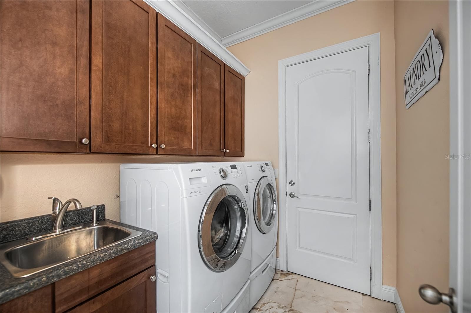 First Floor Laundry Room with Sink and Cabinetry - 290 TAIT TER SE, PORT CHARLOTTE