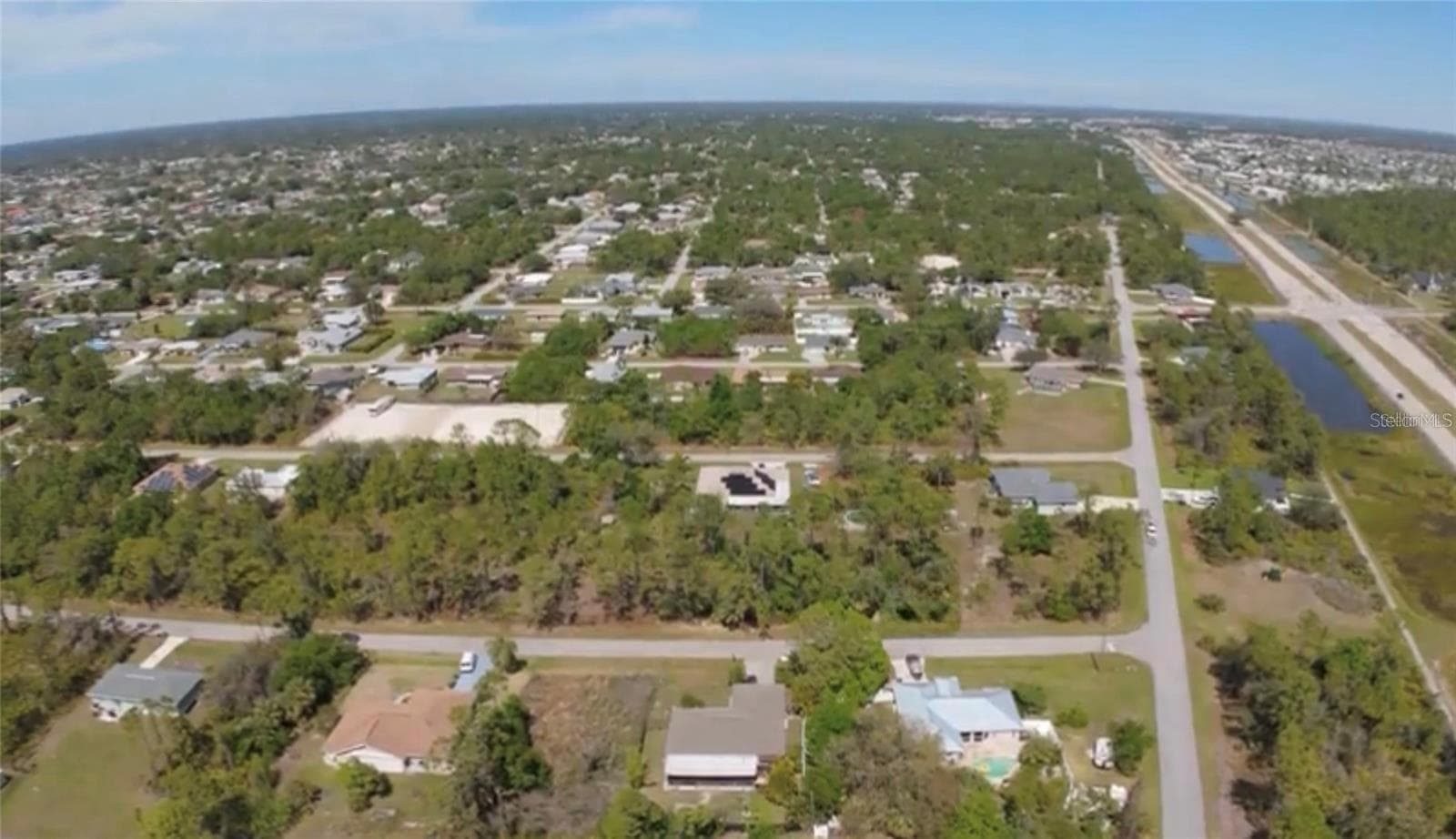 View of the lot and looking north. - 23332 AIRWAY AVE, PORT CHARLOTTE