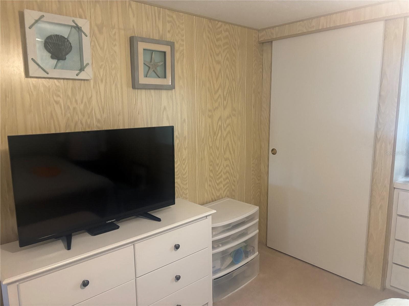 Florida Room.  Behind door is the laundry room/shed. - 105 FREEDOM CT #30, PALM HARBOR