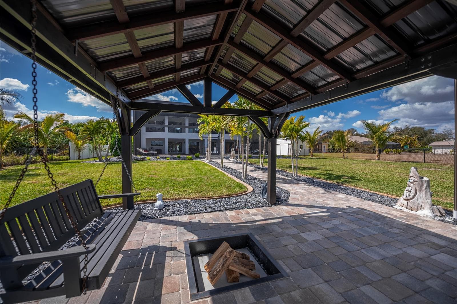 Waterfront Pavilion with Swing Seating and Fire Pit. - 2424 HARBOUR DR, PUNTA GORDA