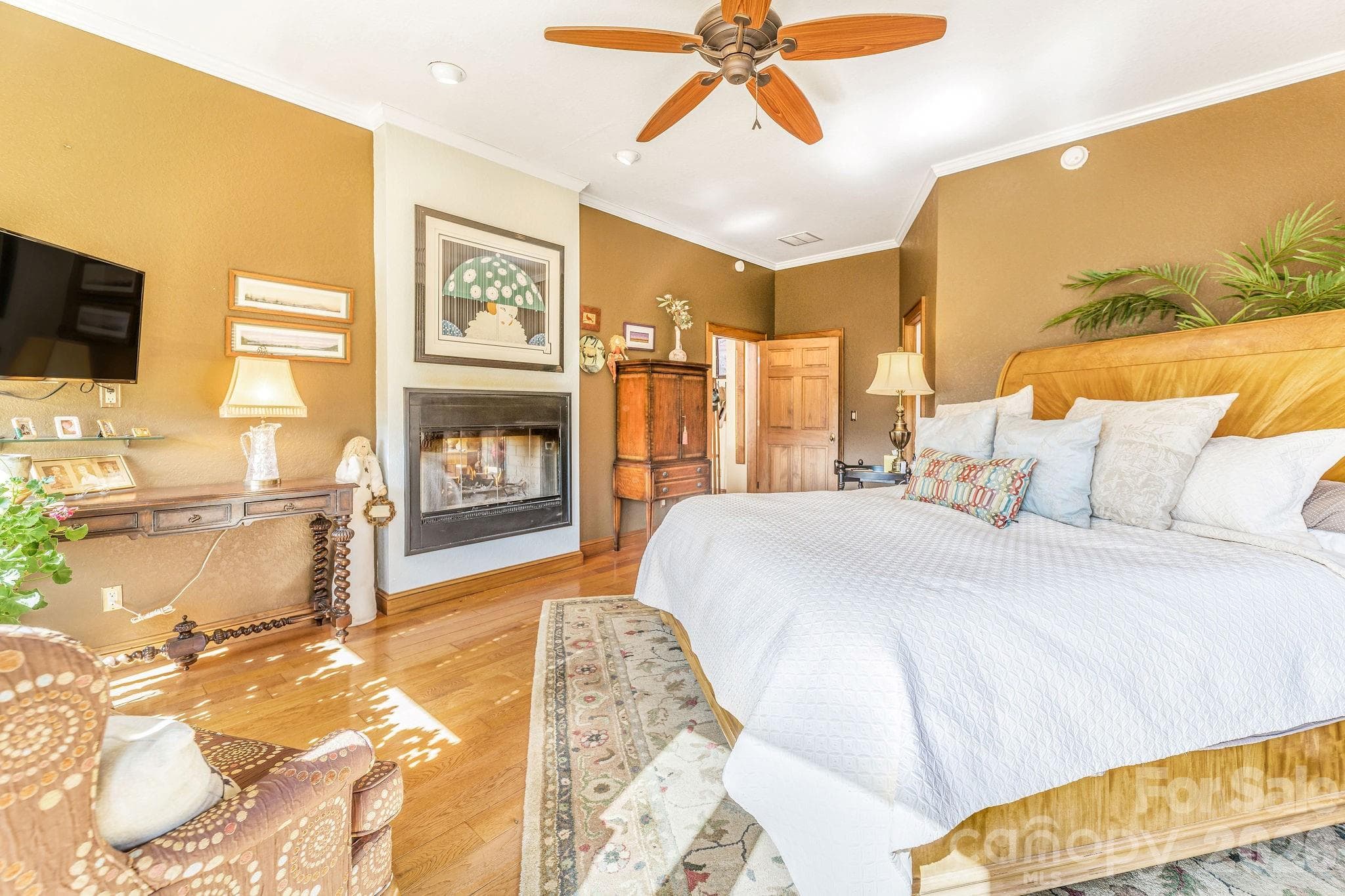 Primary bedroom and living room share double sided fireplace - 22 Mountain Spring Lane, Canton