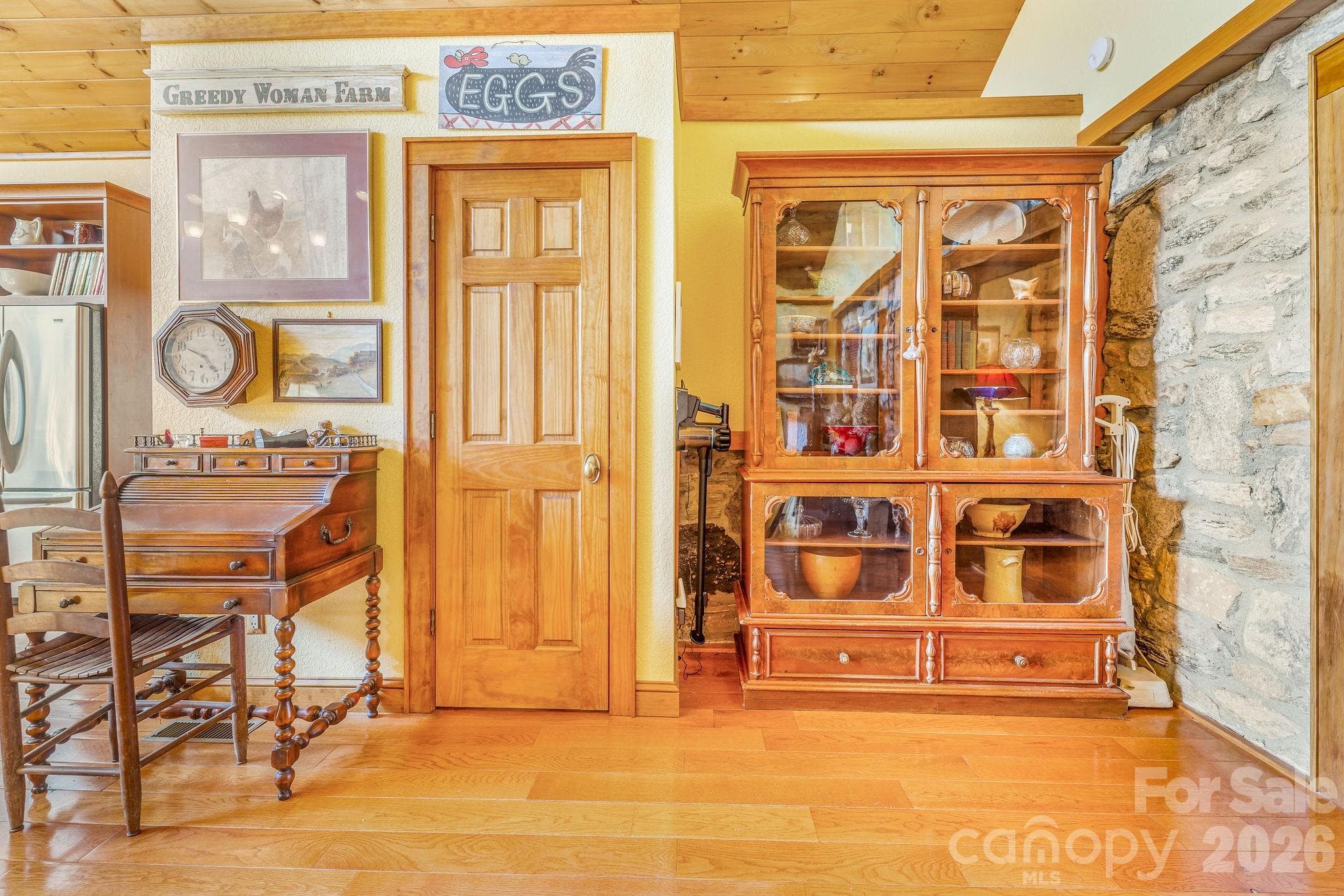 Exposed stone of original home adds visual interest in the living area addition - 22 Mountain Spring Lane, Canton
