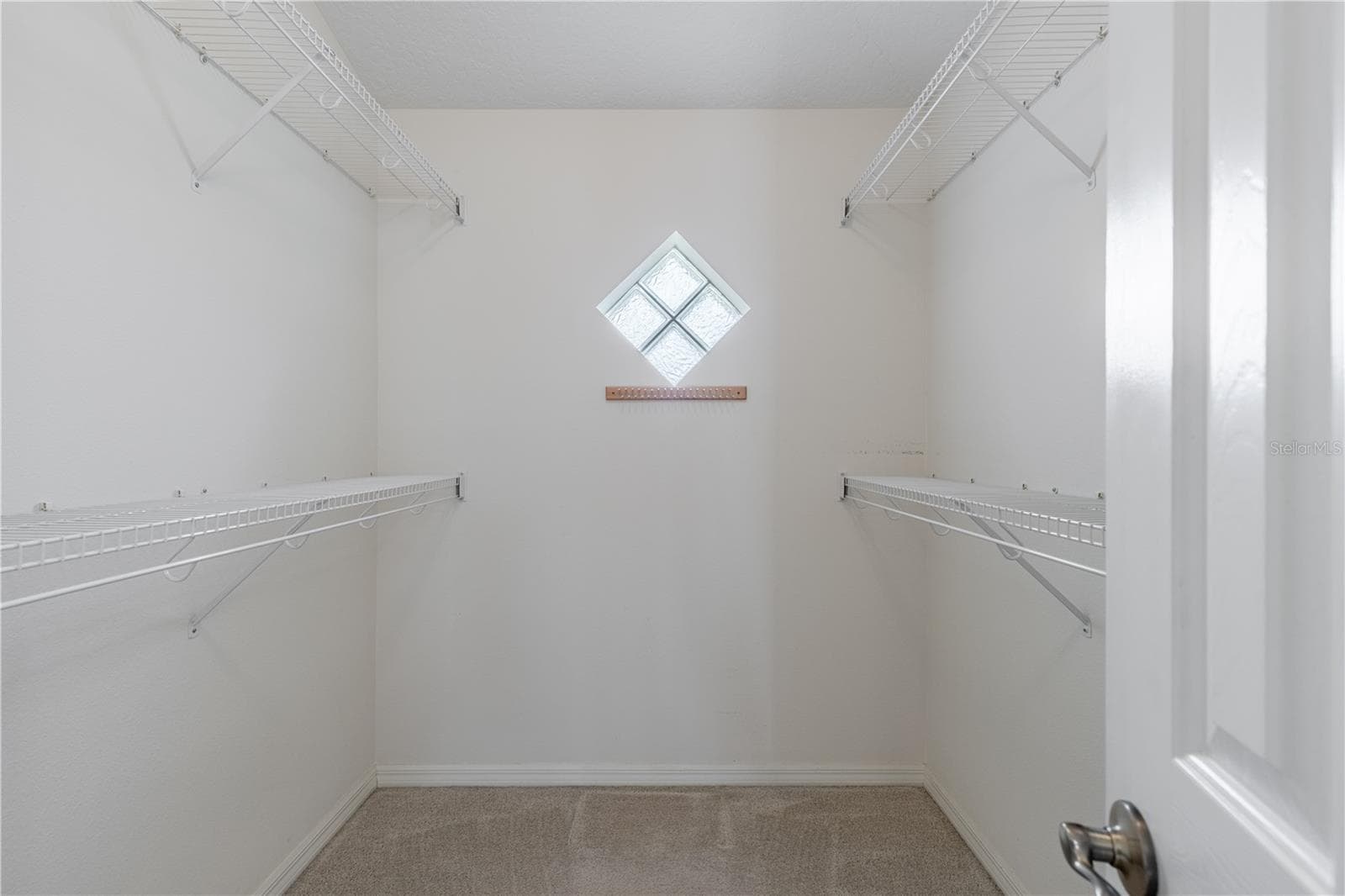 Primary walk in closet - 5732 FREEPORT DR, TAVARES