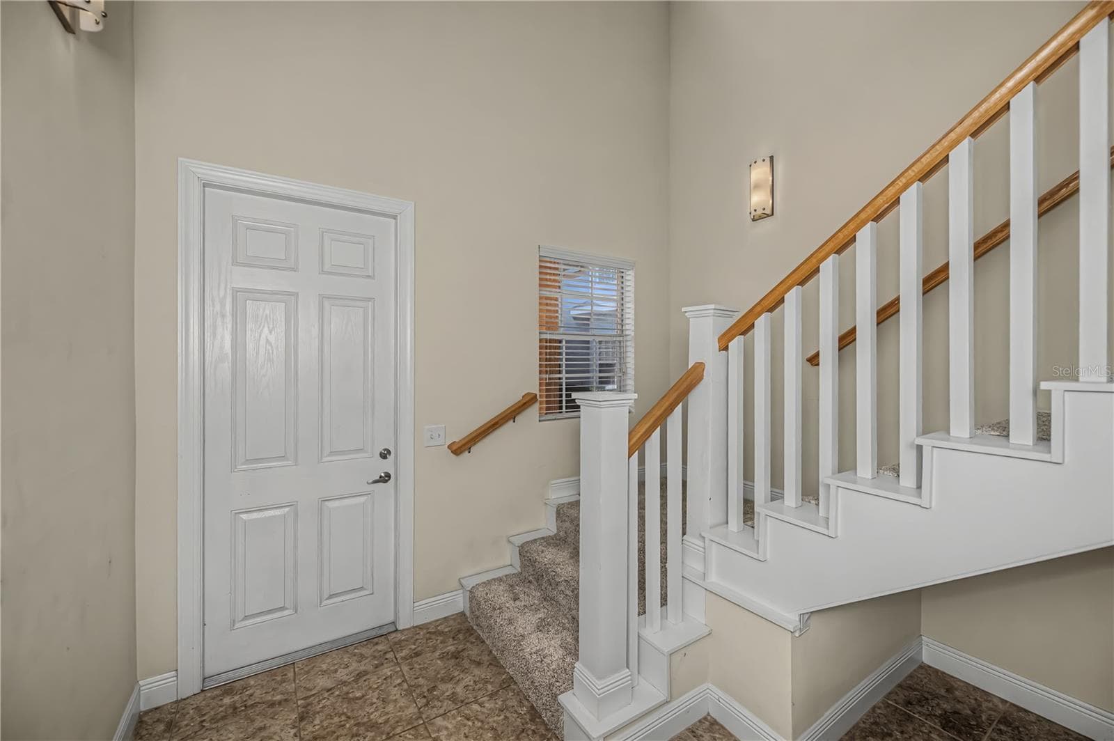 front door first floor foyer entry - 25601 HERITAGE LAKE BLVD #46, PUNTA GORDA