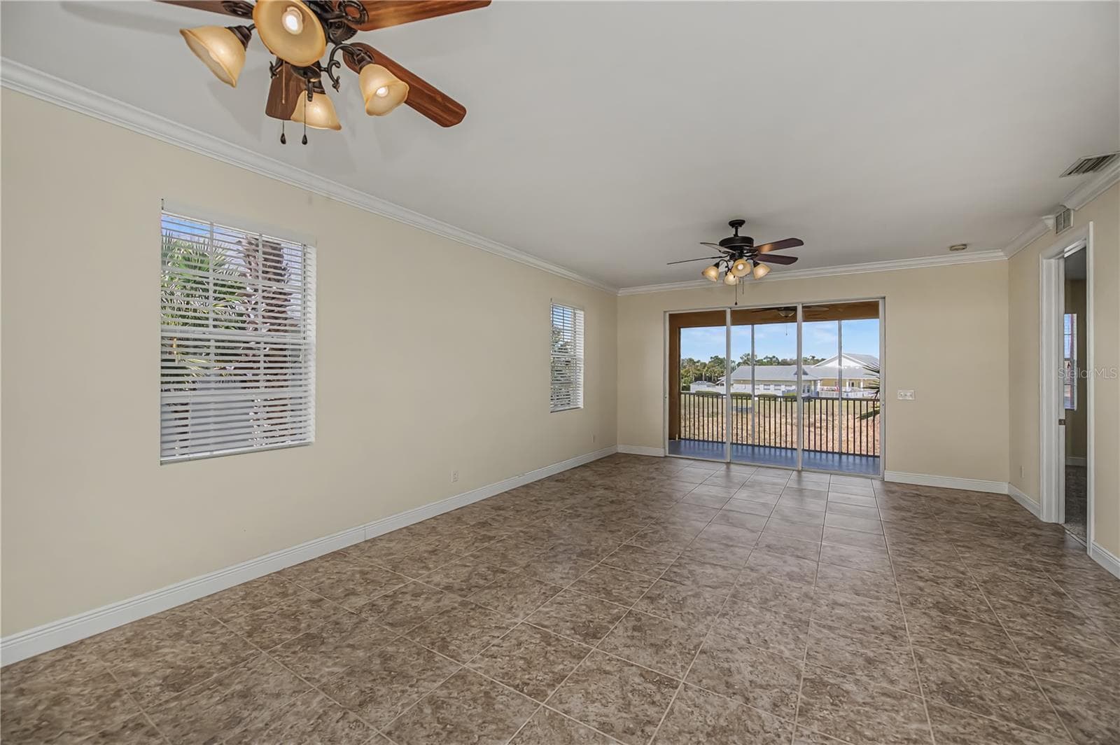 great room with a water view - 25601 HERITAGE LAKE BLVD #46, PUNTA GORDA