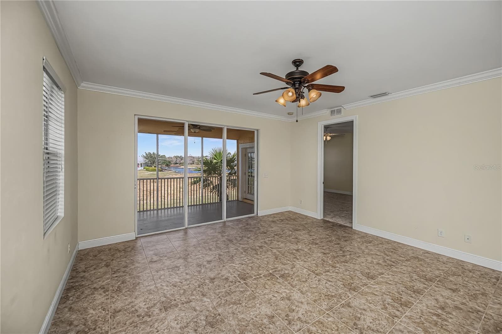 great room to lanai and primary bedroom - 25601 HERITAGE LAKE BLVD #46, PUNTA GORDA