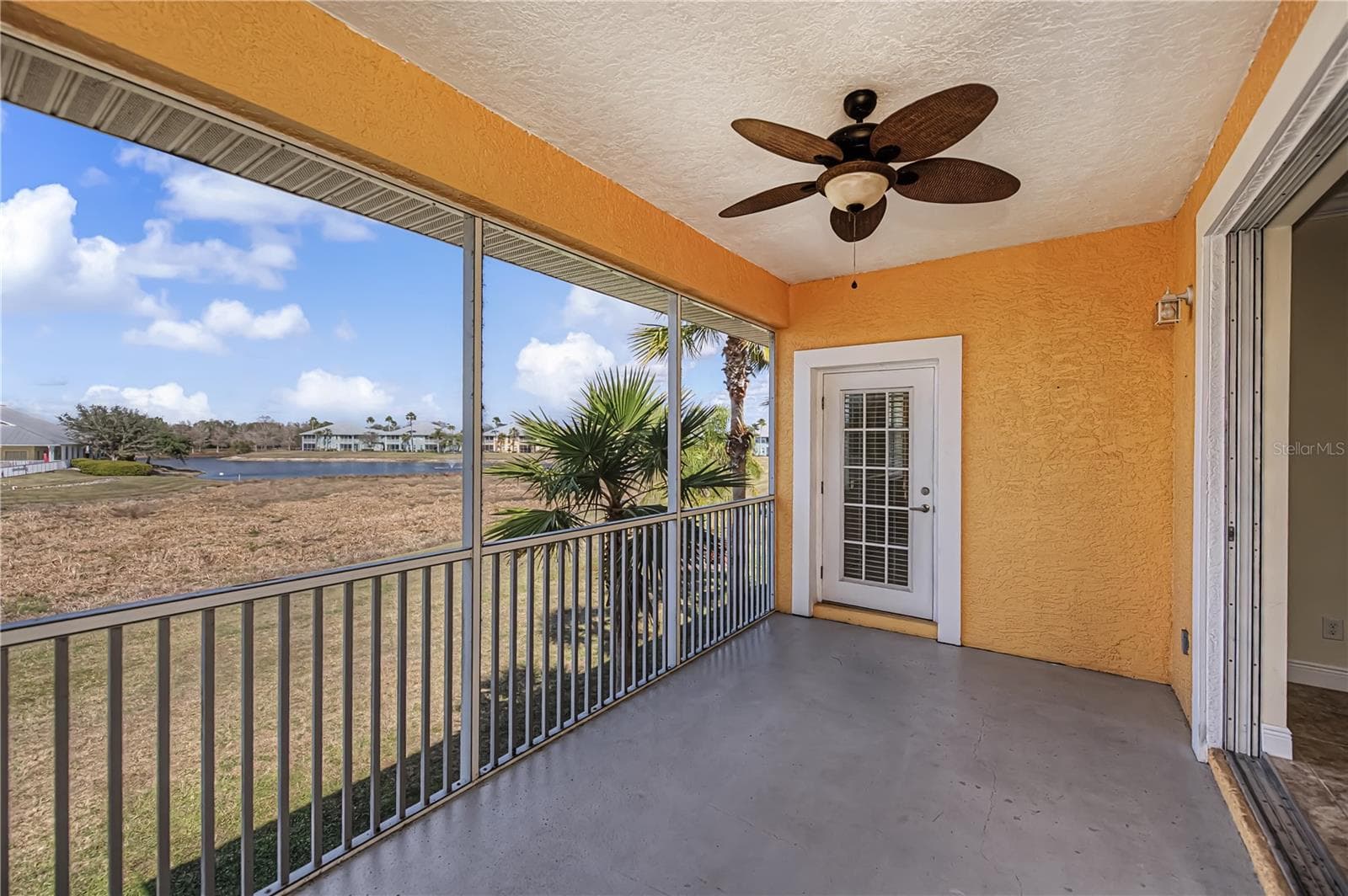 balcony lanai with a view - 25601 HERITAGE LAKE BLVD #46, PUNTA GORDA