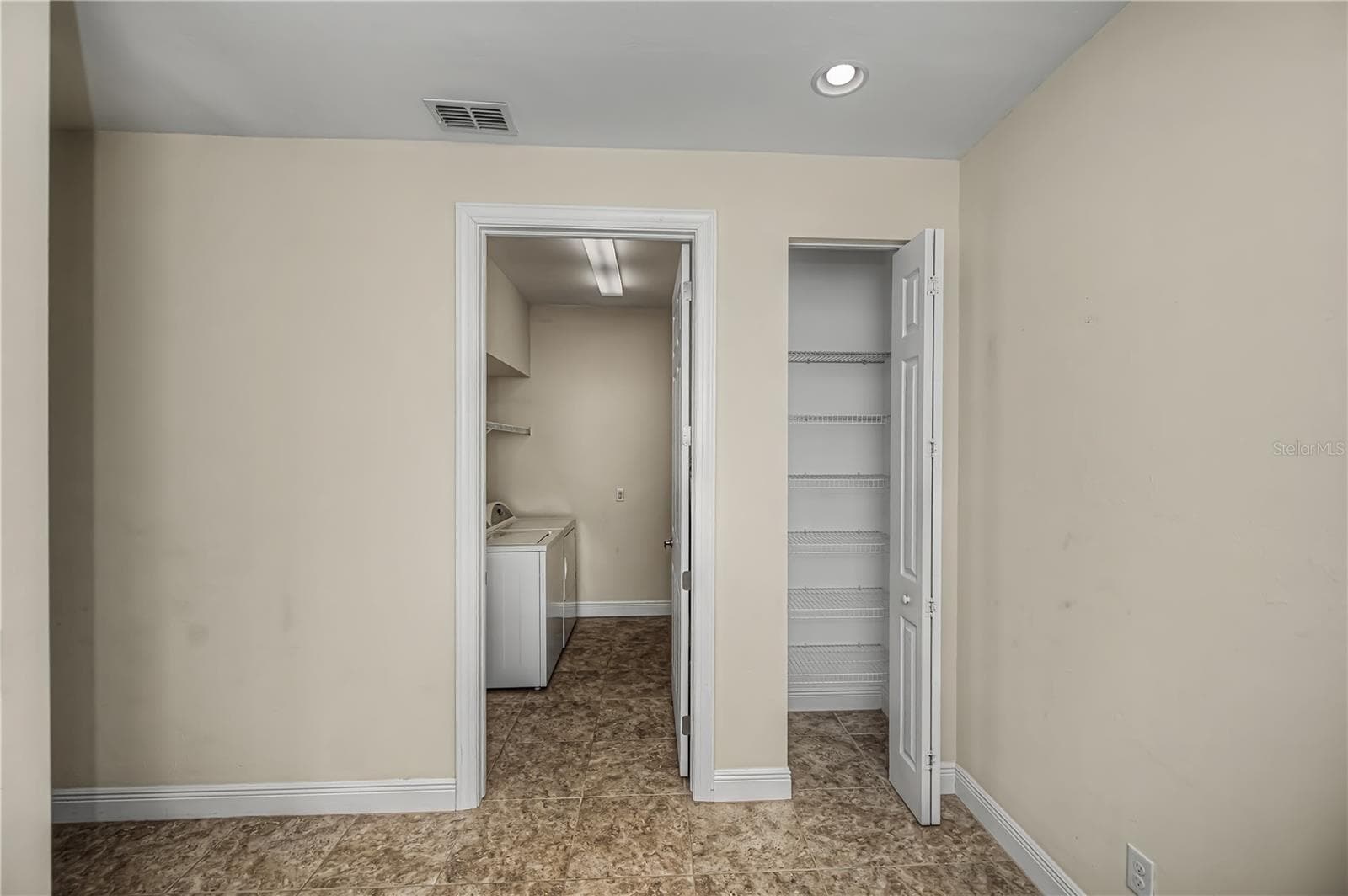 laundry room and linen closet - 25601 HERITAGE LAKE BLVD #46, PUNTA GORDA