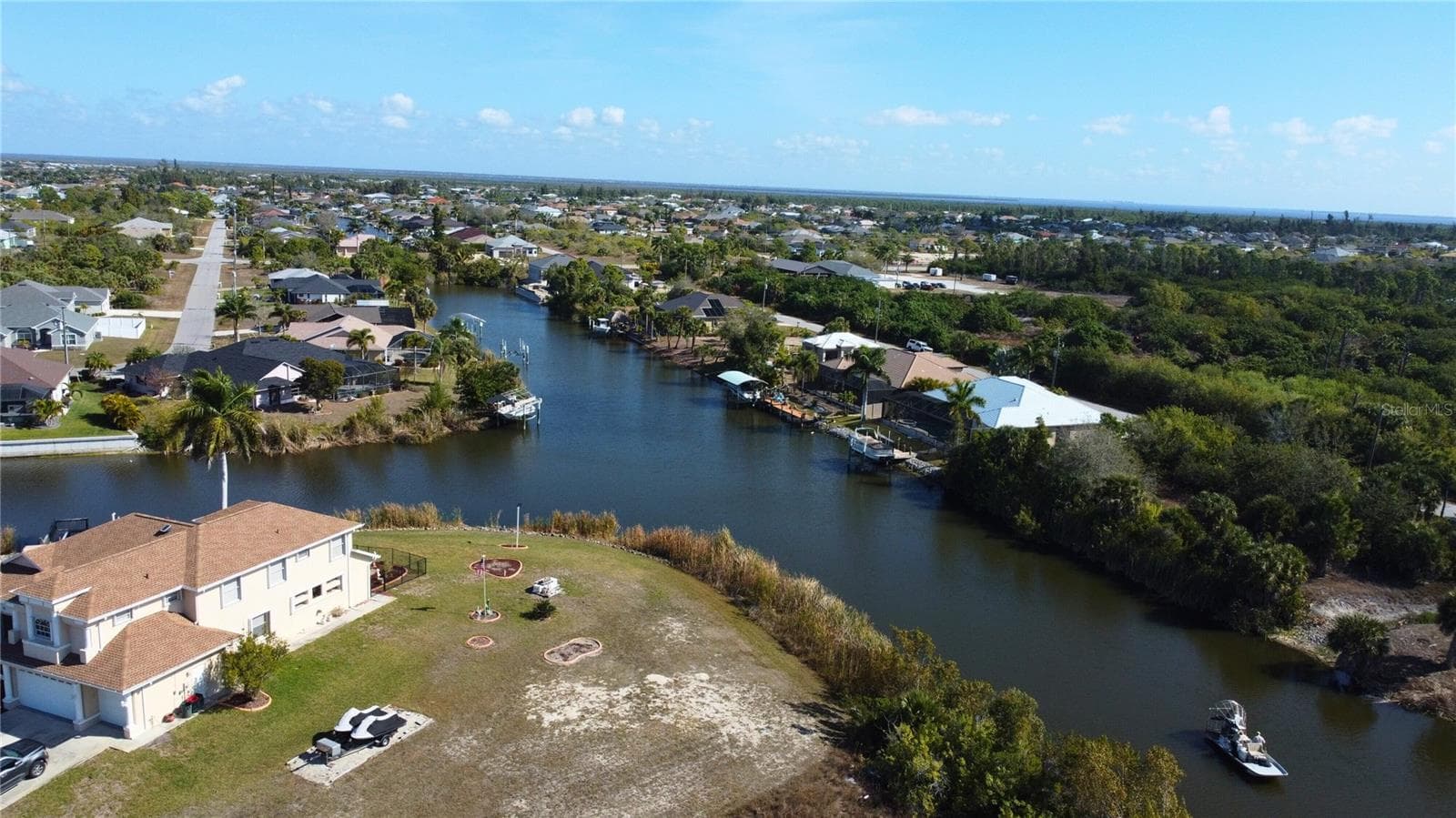 View of property location with a nearby body of water and nearby suburban area - 9548 ATTICA CIR, PORT CHARLOTTE